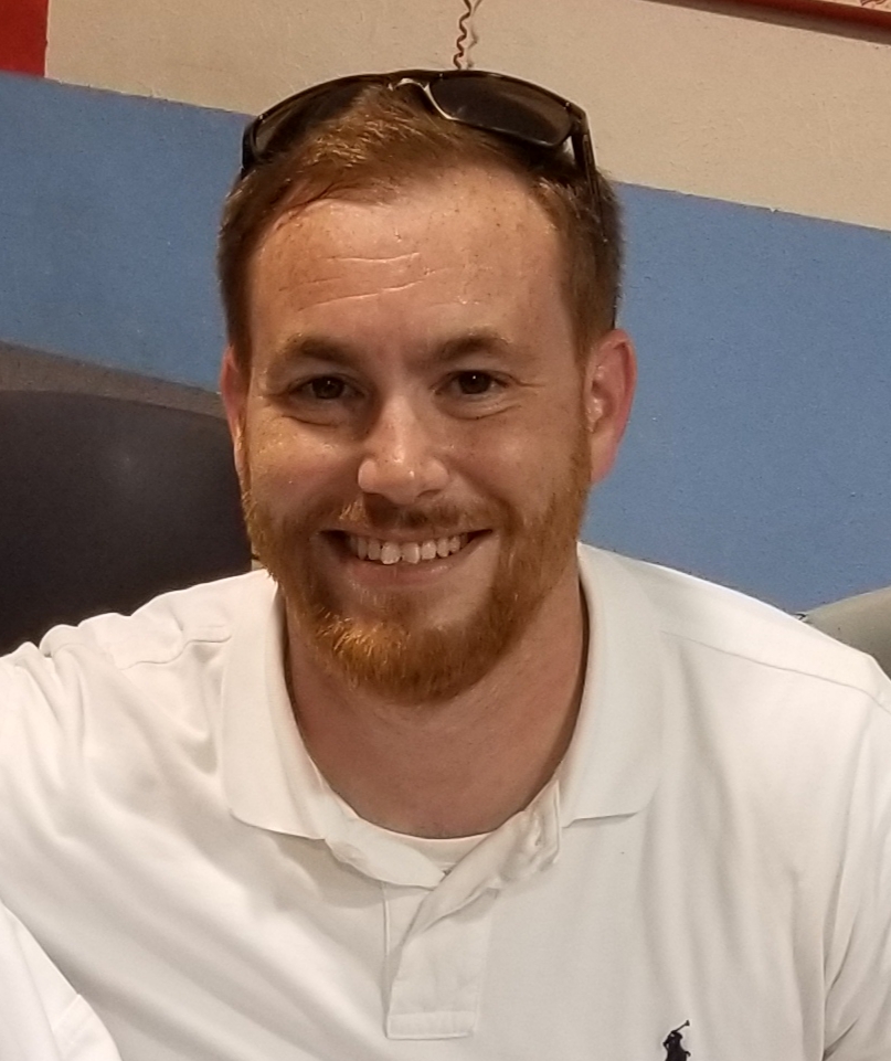 Paul Gover smiling in a white polo shirt