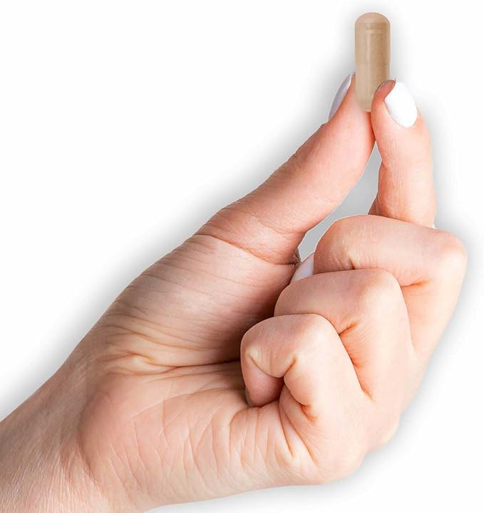 Hand holding capsule