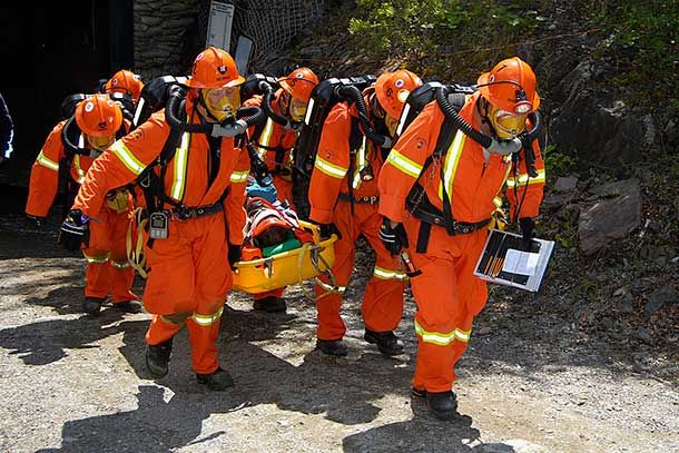 Emergency Services Officer carrying stretcher during rescue training