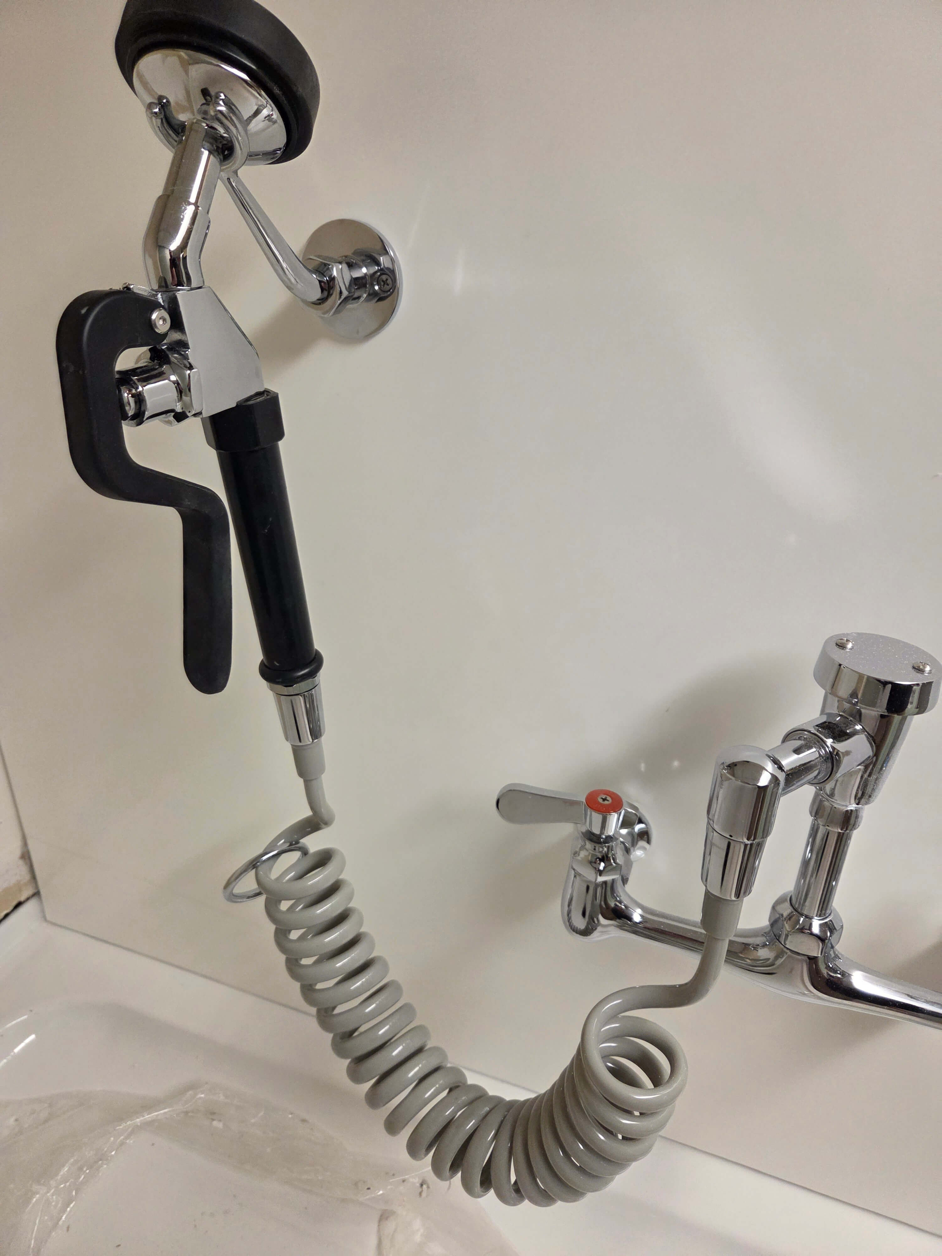 Commercial dog wash faucet with coiled sprayer