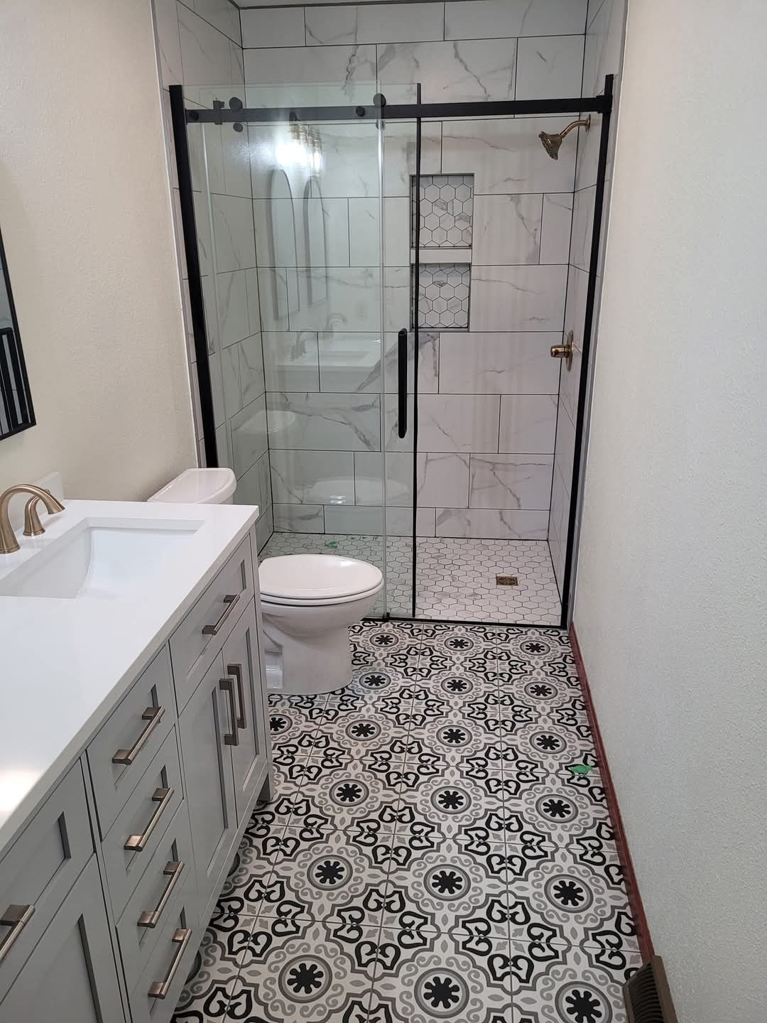 Zero-entry shower with encaustic floor tile