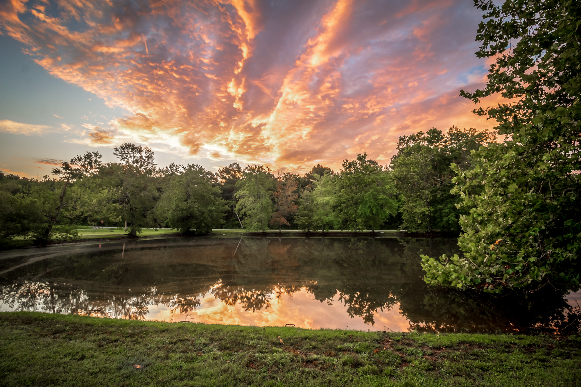 Golden hour reflection with dramatic sky