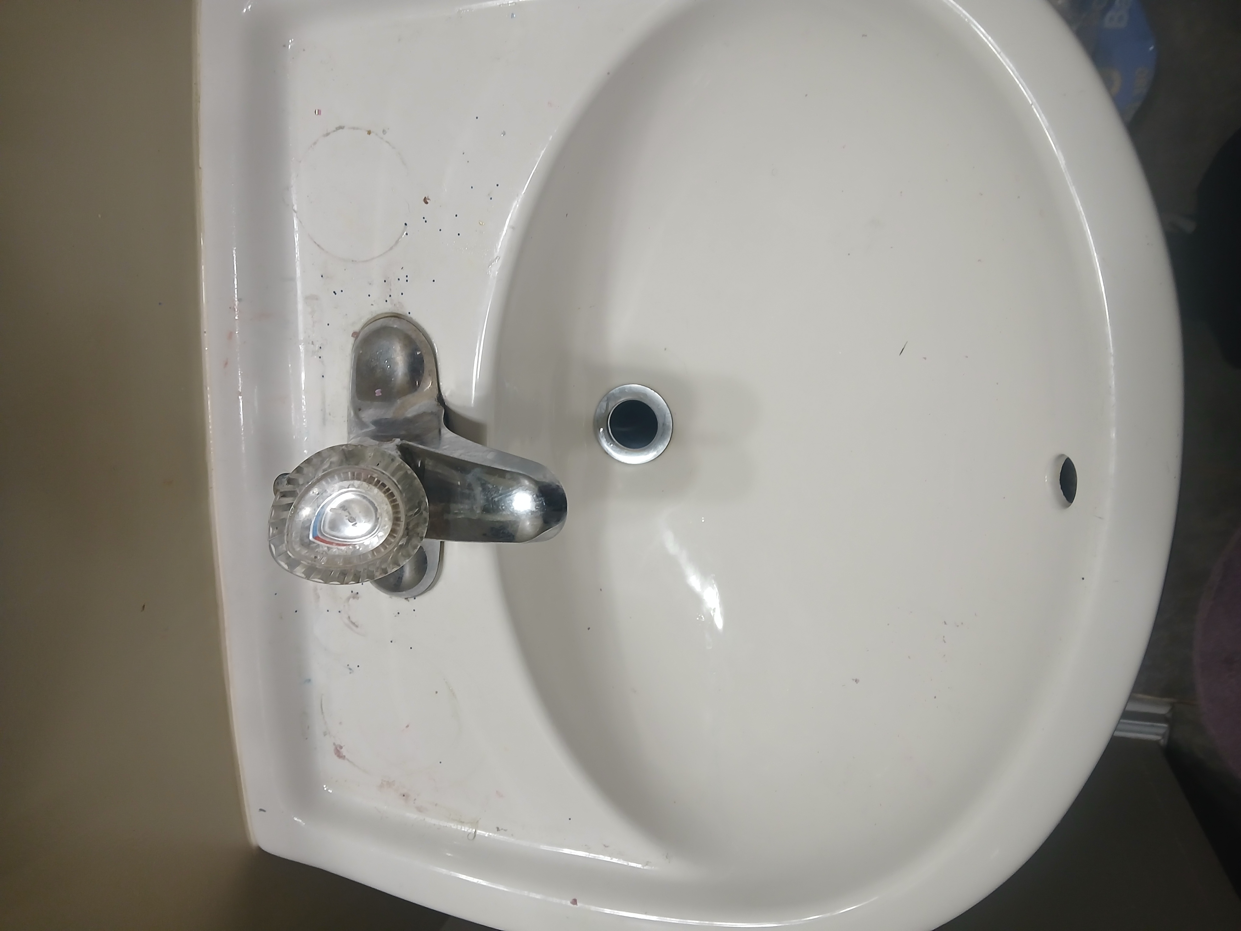 Bathroom sink after — pristine chrome, sparkling surface