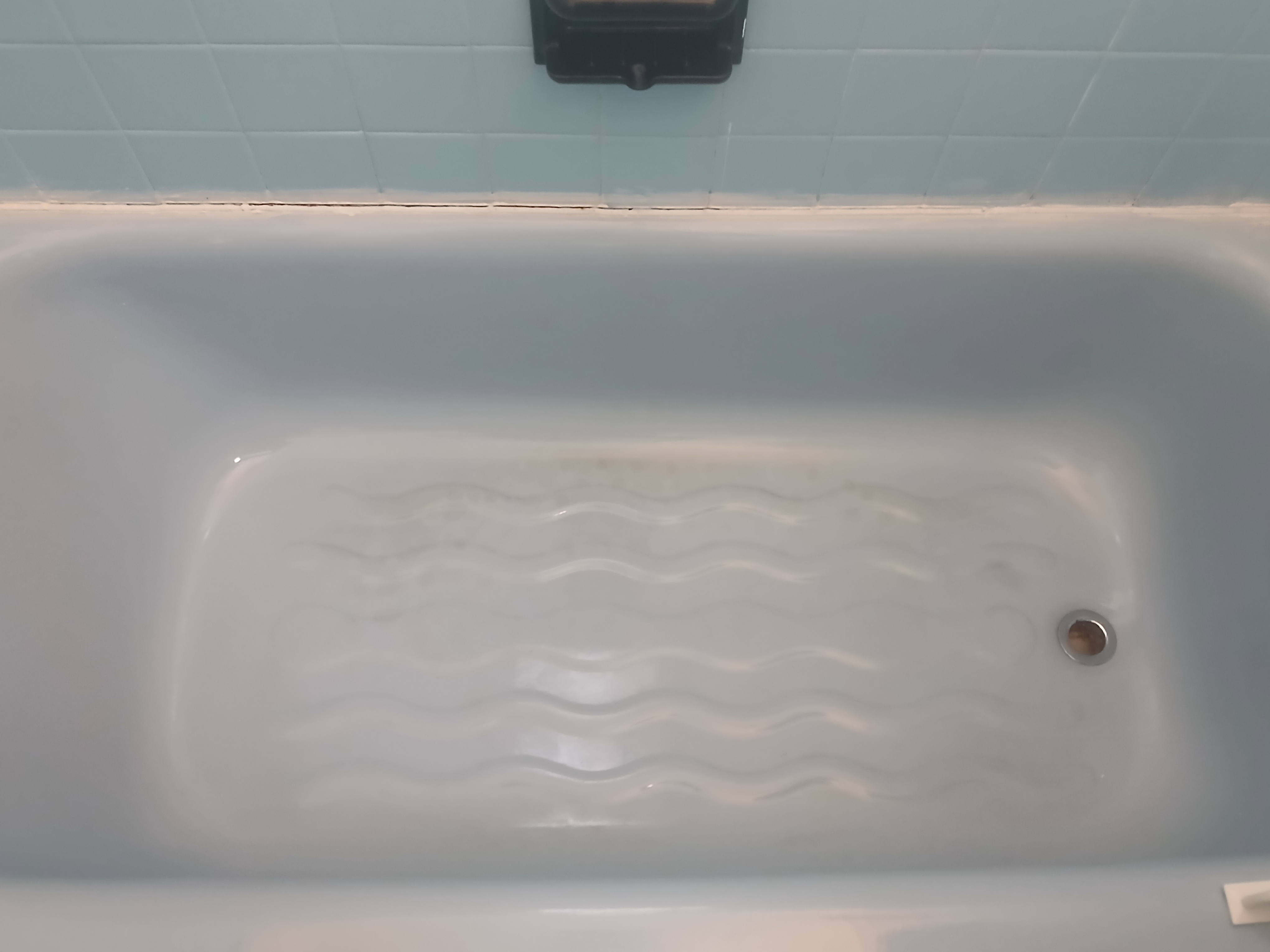 Bathtub after cleaning — gleaming white