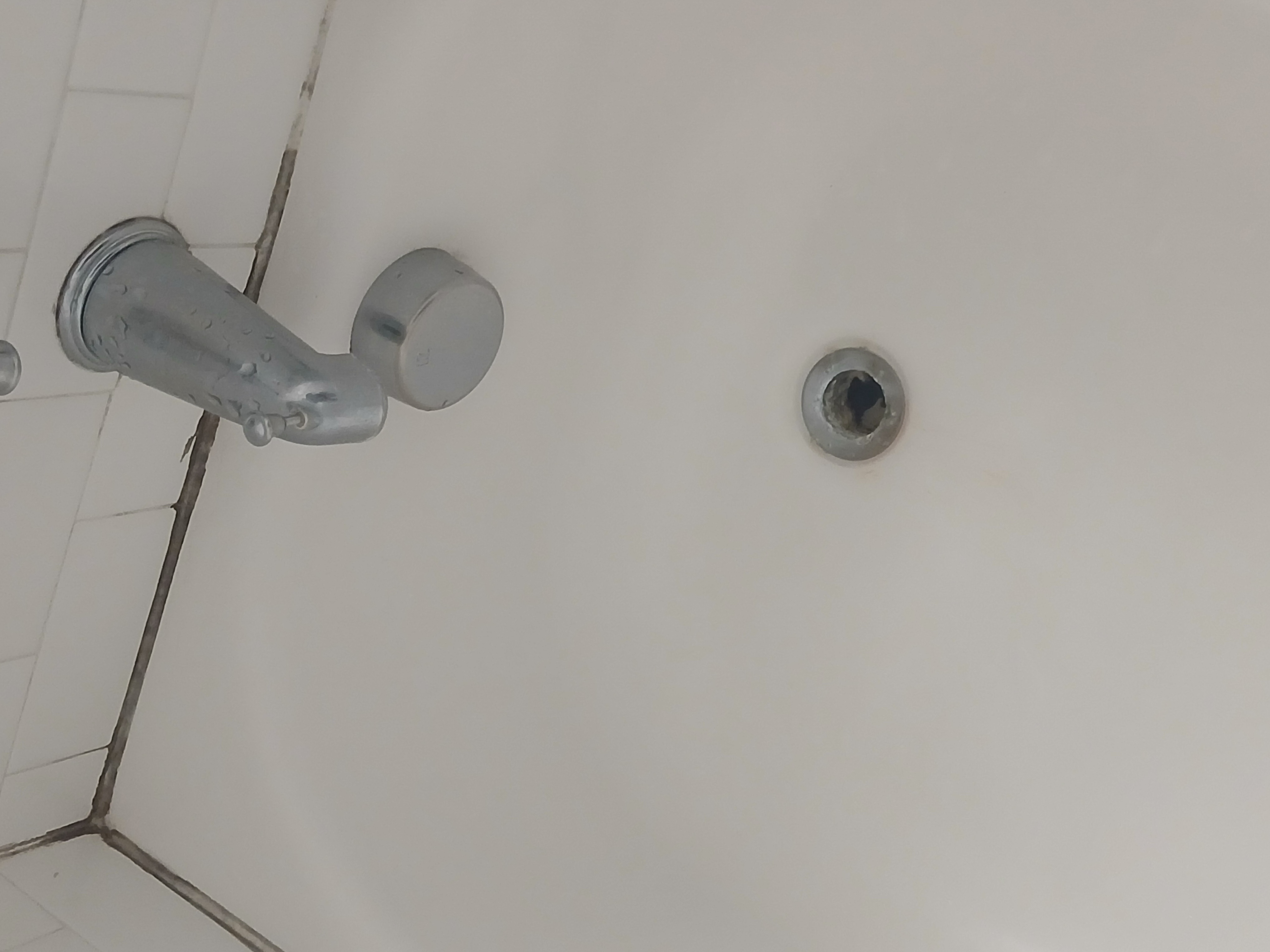 Bathroom ceiling after — cleaned, mold removed, fresh finish