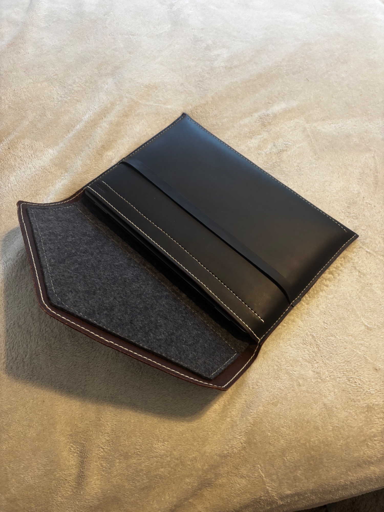 Wool felt interior — flap open showing 840 gsm felt lining