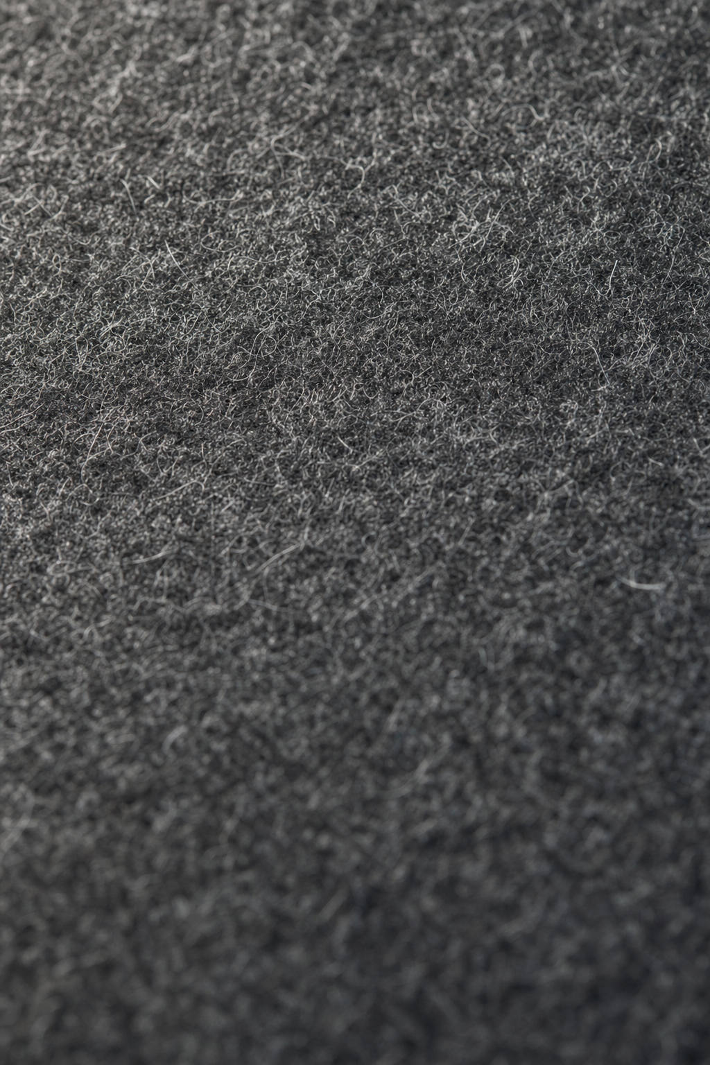 840 gsm wool felt interior — close-up of dense wool fiber weave