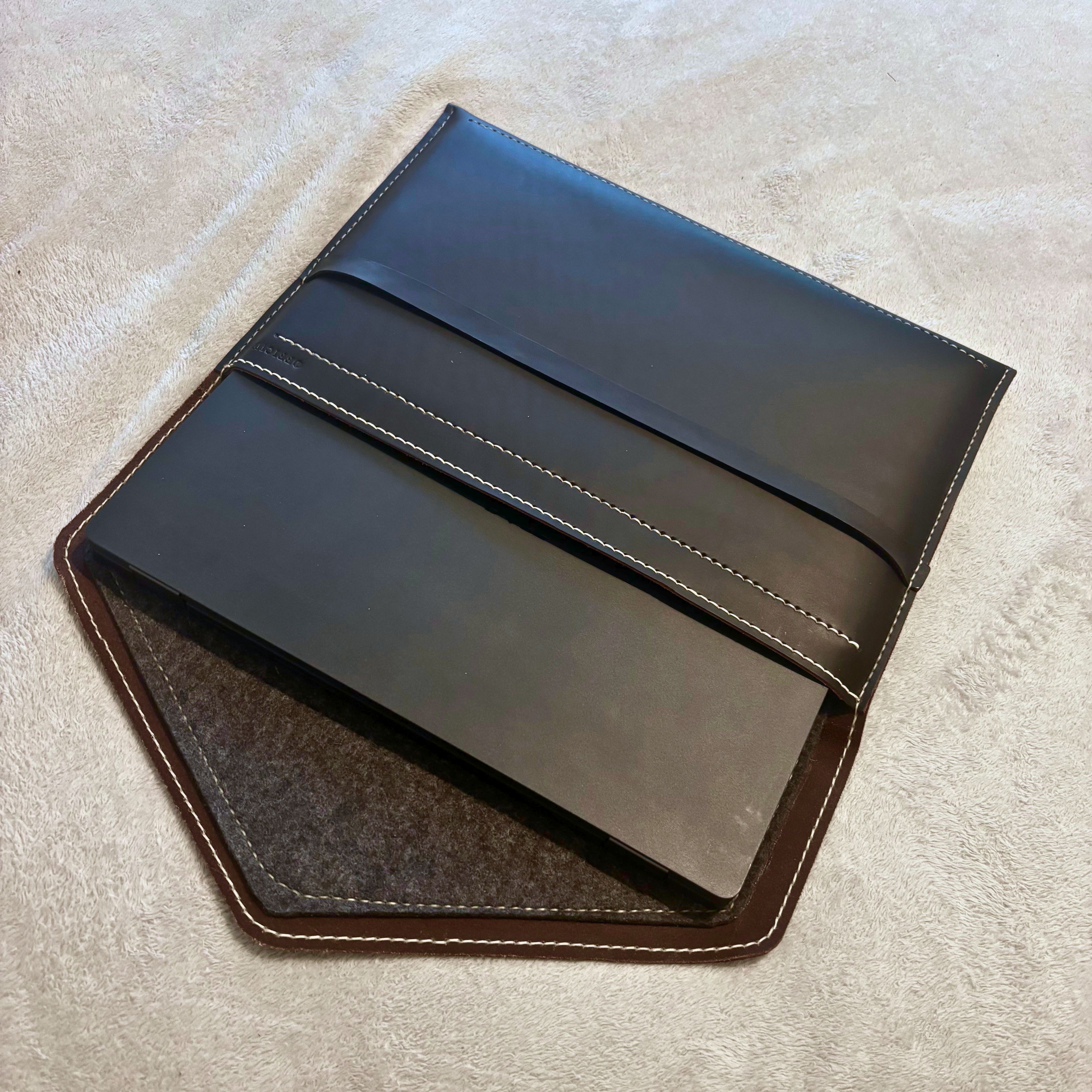 The Tailored Laptop Sleeve — precision fit with laptop inside, open view