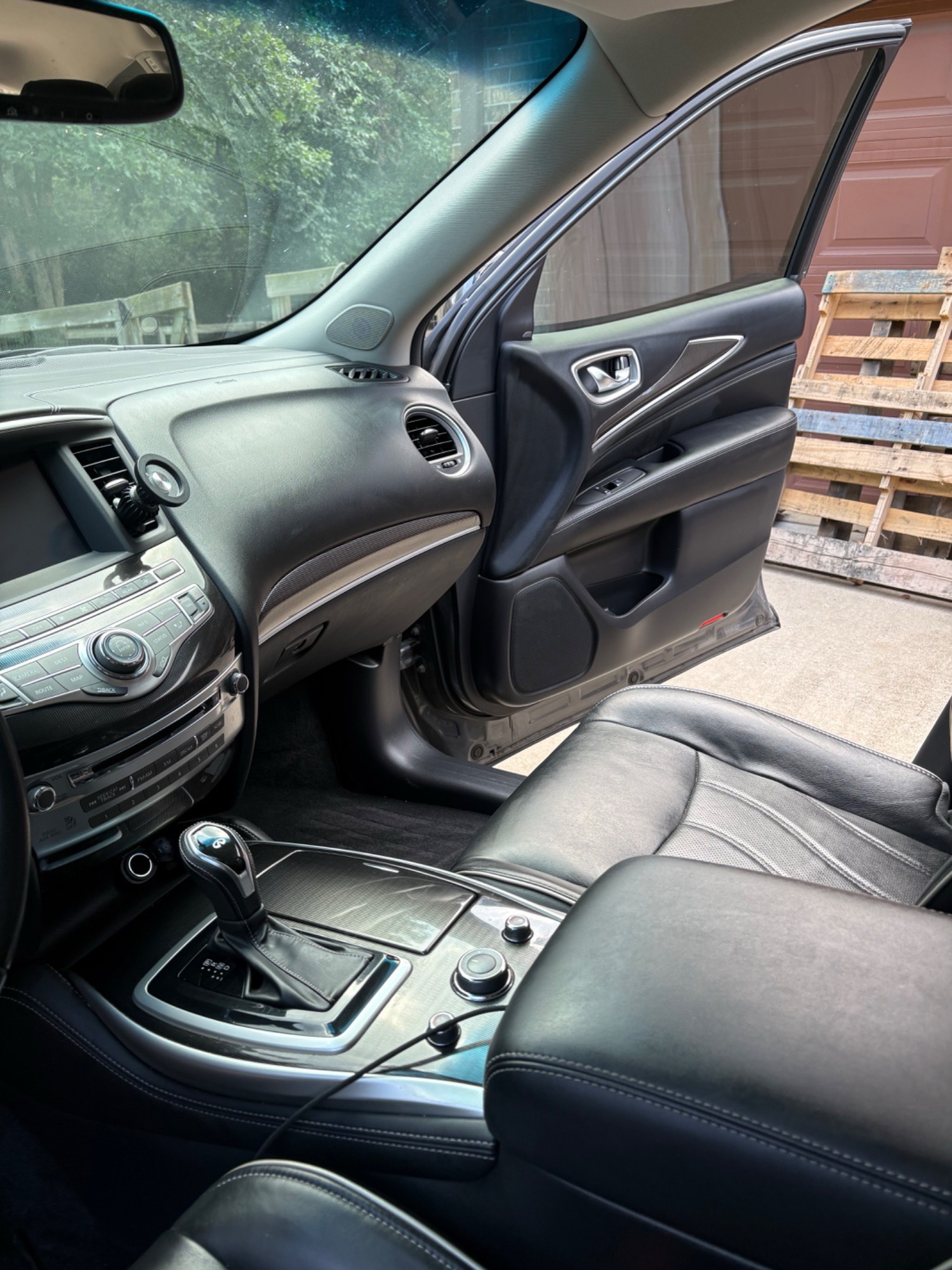Clean Infiniti interior after mobile detailing — polished dashboard and seats