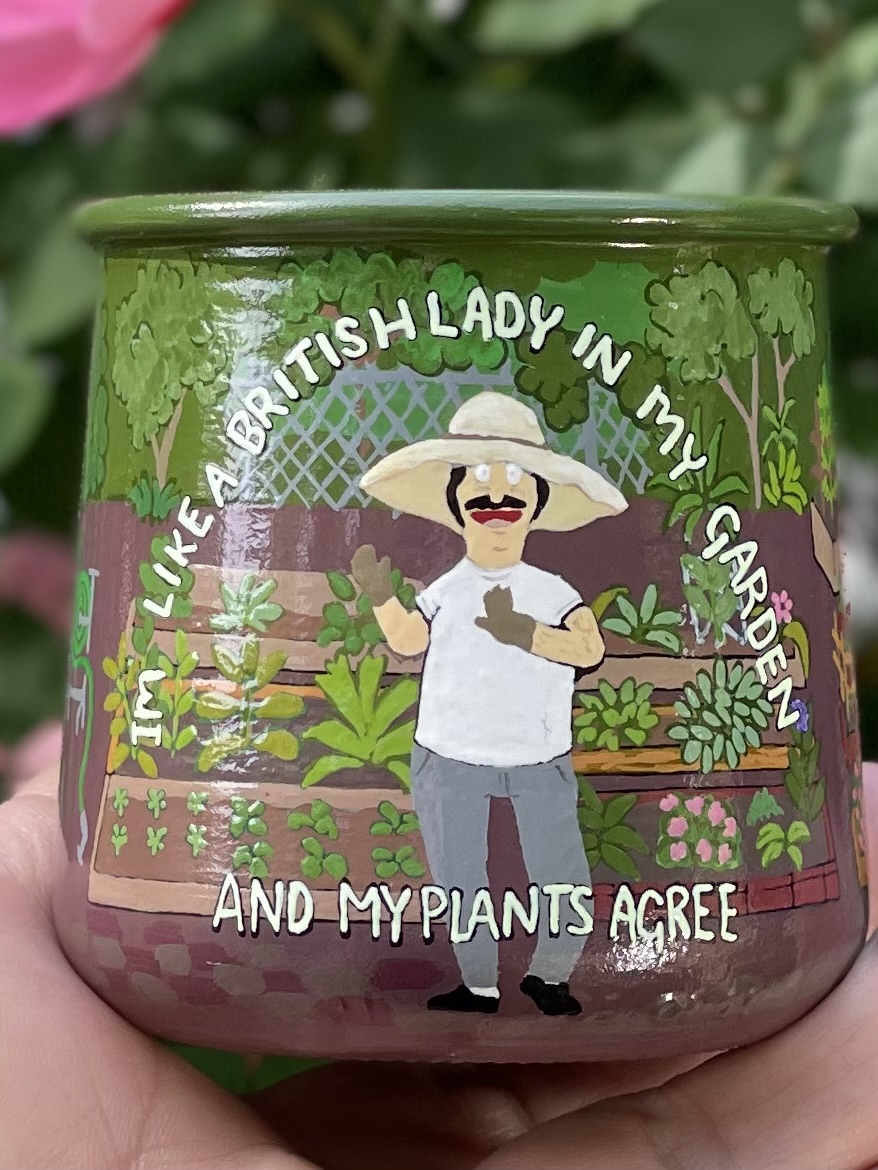 Custom garden jar with British lady and raised beds painted on the outside