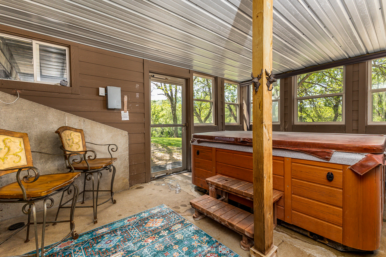 Private Hot Tub on covered patio with wooded views