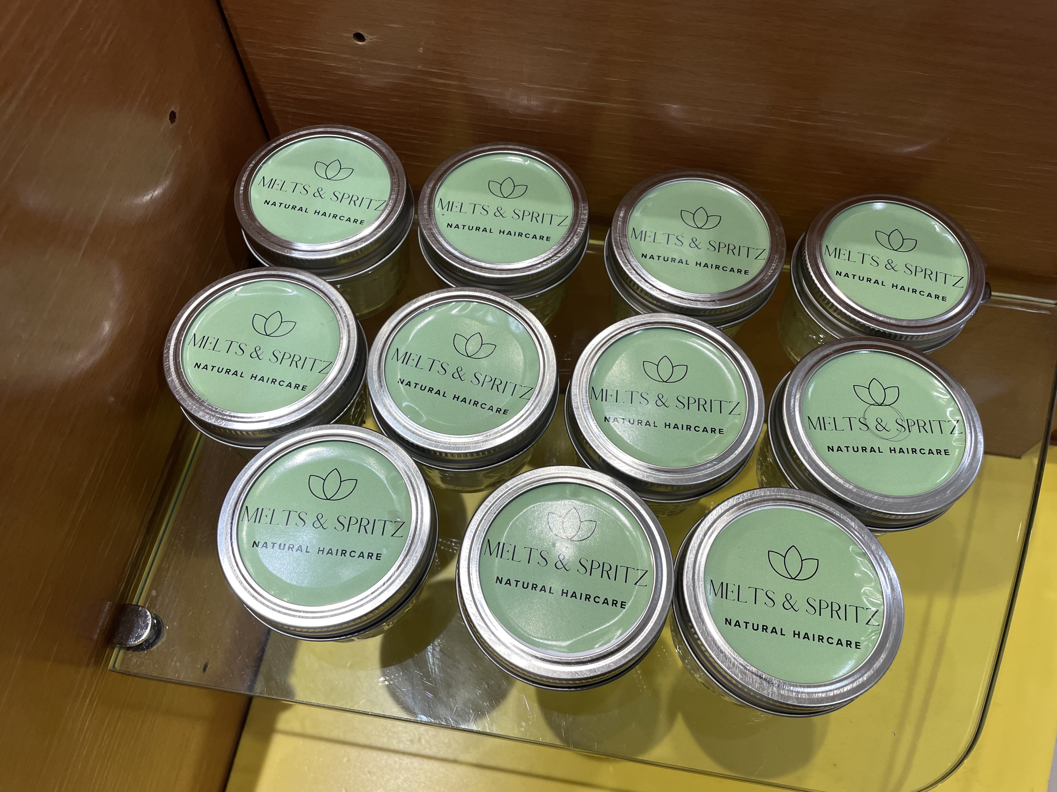 Meltz & Spritz labeled jars — handmade Ayurvedic hair care