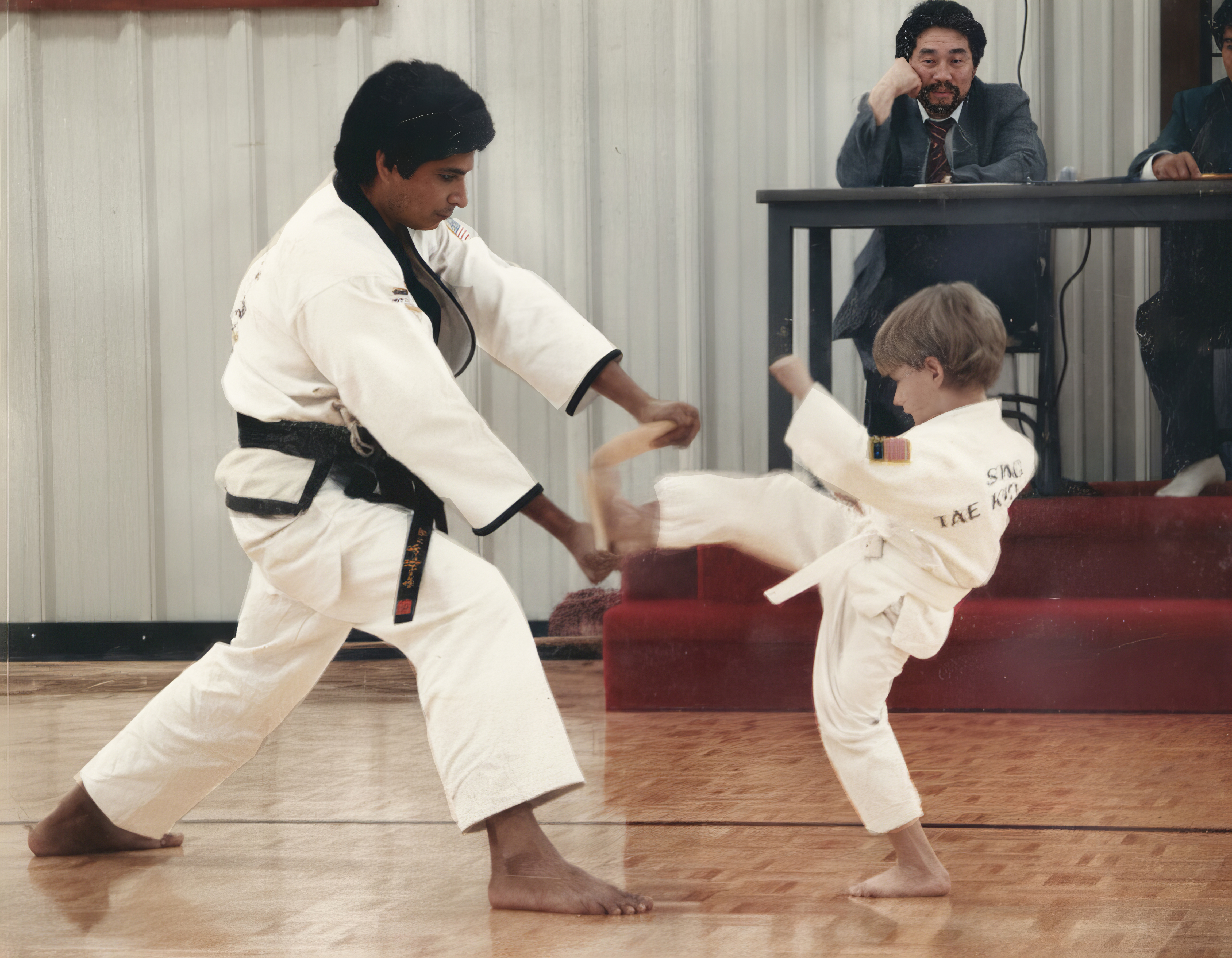After restoration — 1980's Taekwondo family picture with water damage from flooded basement