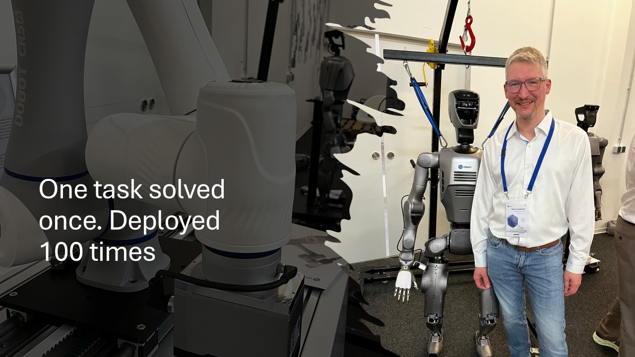 Iniationware founder with DOBOT robots at trade show - One task solved once. Deployed 100 times.