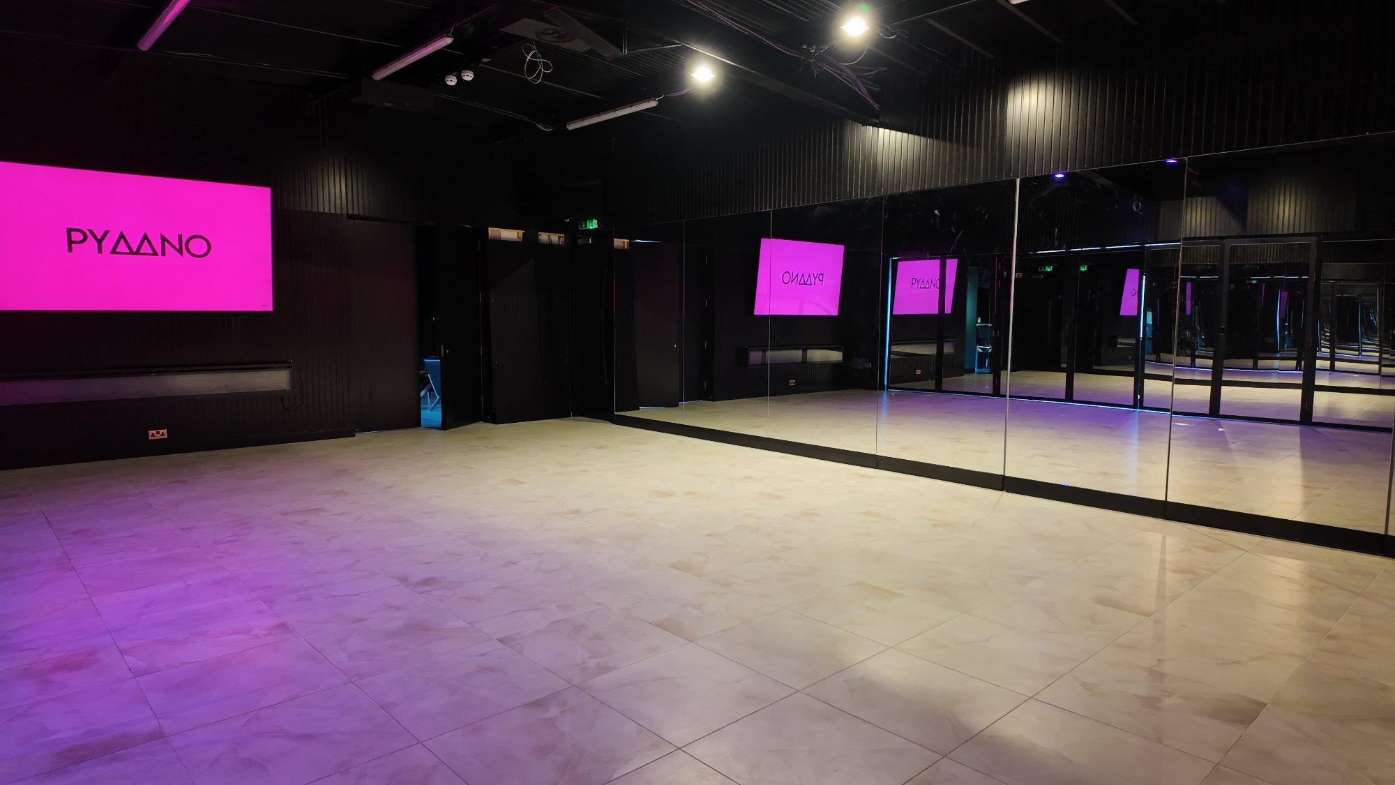PYAANO Studio — mirrored walls and open floor