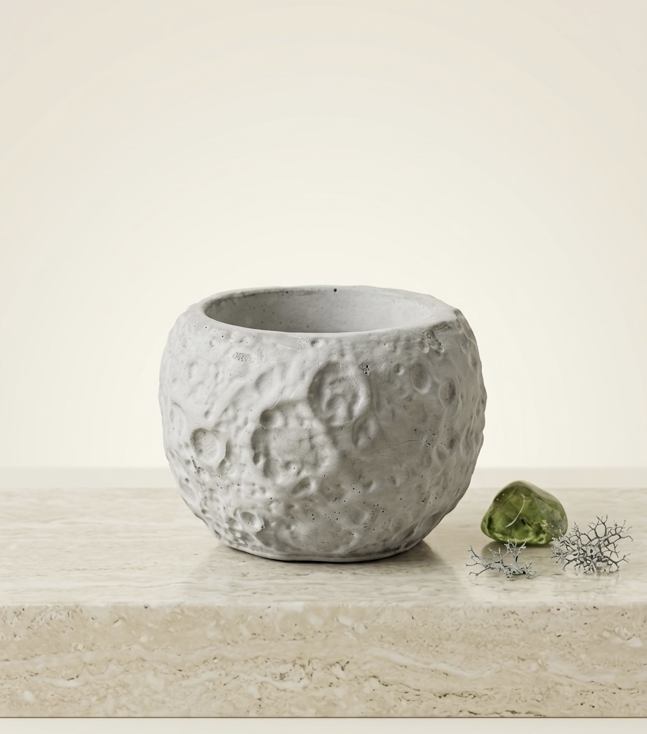 La Luna moon crater-textured cement vessel — clean product shot showing lunar surface texture detail