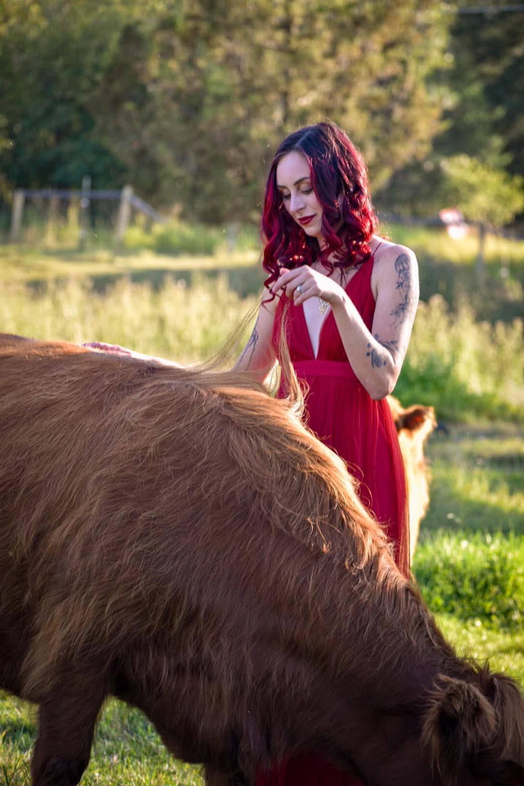 A family holding a small child close during a family session at the Moolady paddock in Clinton, Montana.