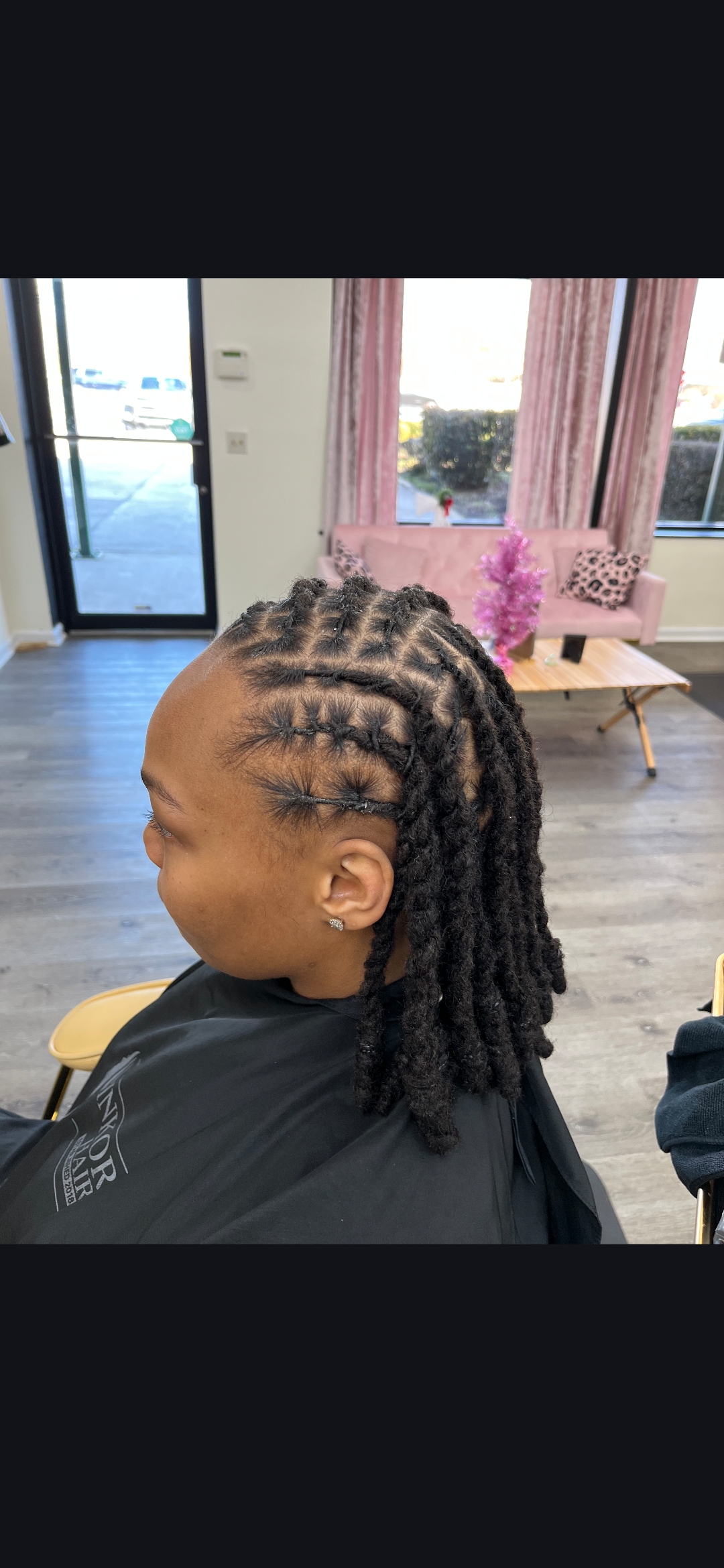 Clean loc retwist with diamond parting — professional loc maintenance at Sinkor Beauty Salon Delaware