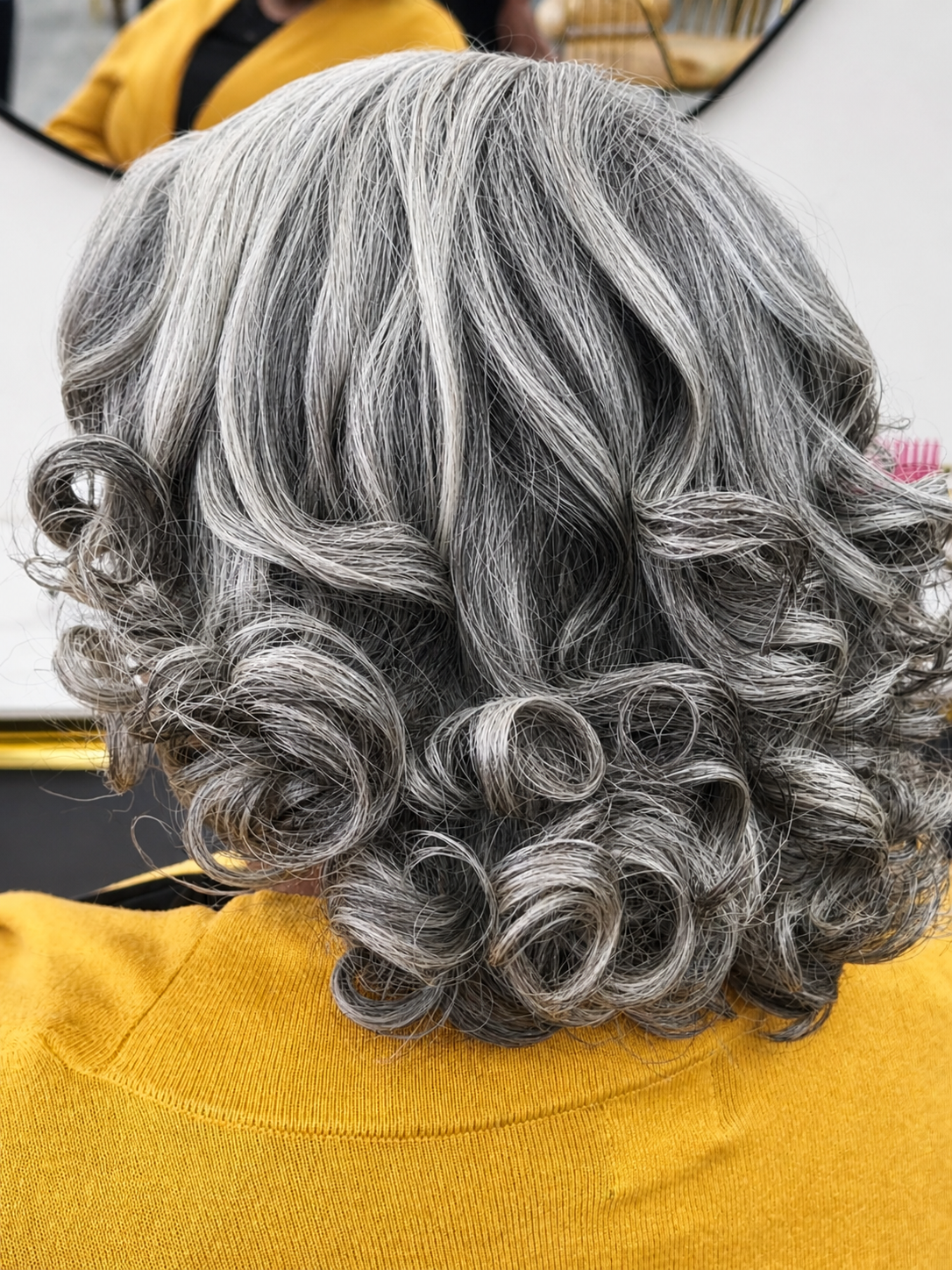 Silver/gray curls silk press result at Sinkor Beauty
