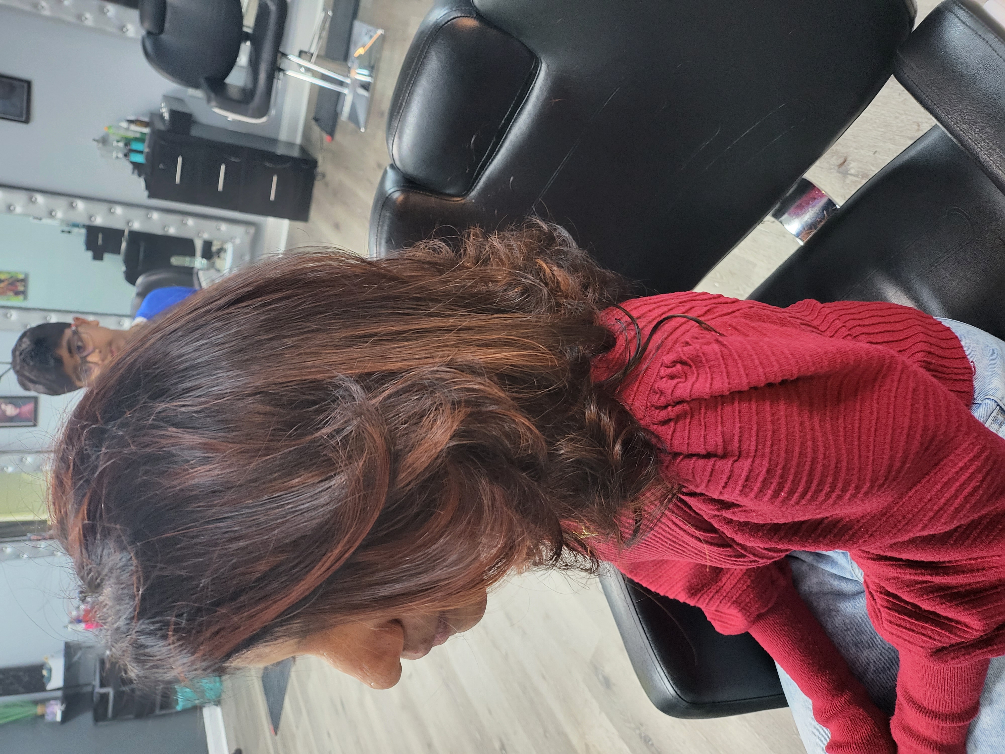 Layered blowout with warm tones at Sinkor Beauty