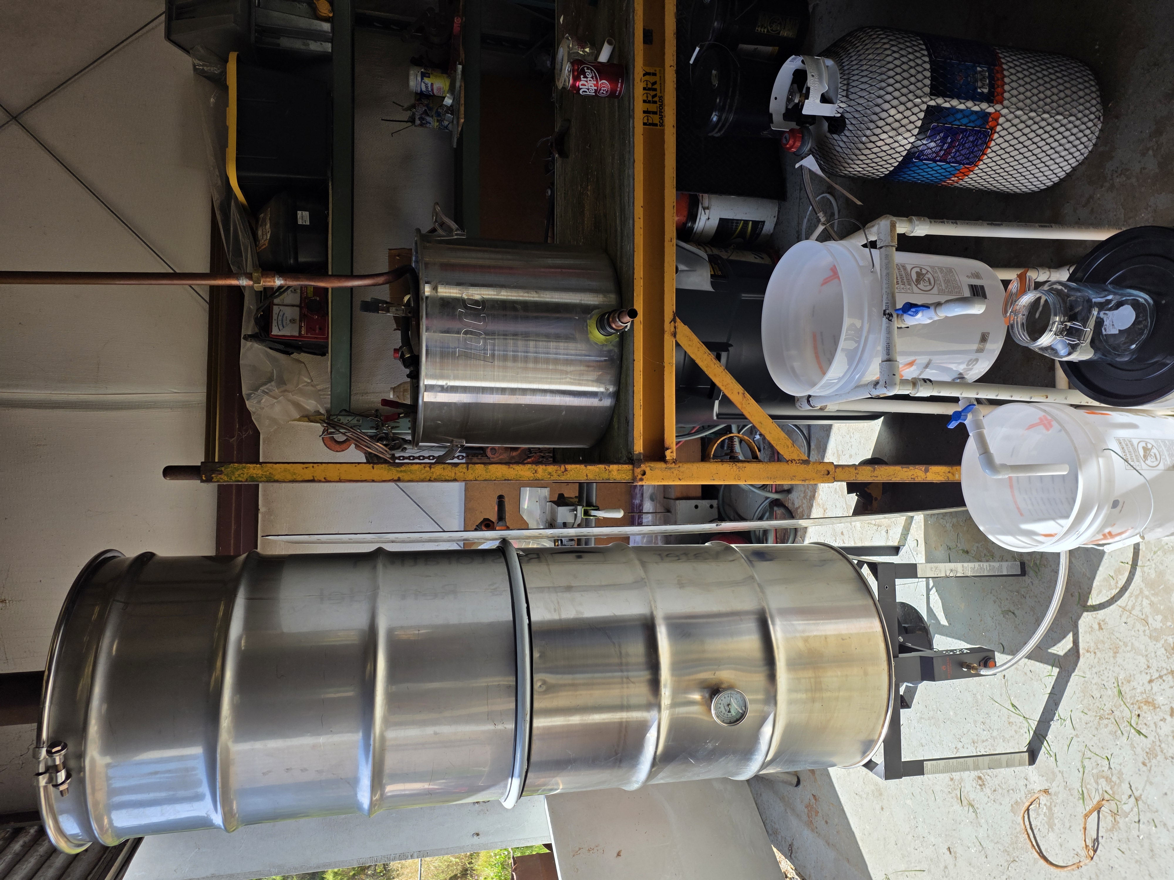 The Brenton family-crafted still, with a stainless-steel main body and copper condenser, in the farm distillation workspace