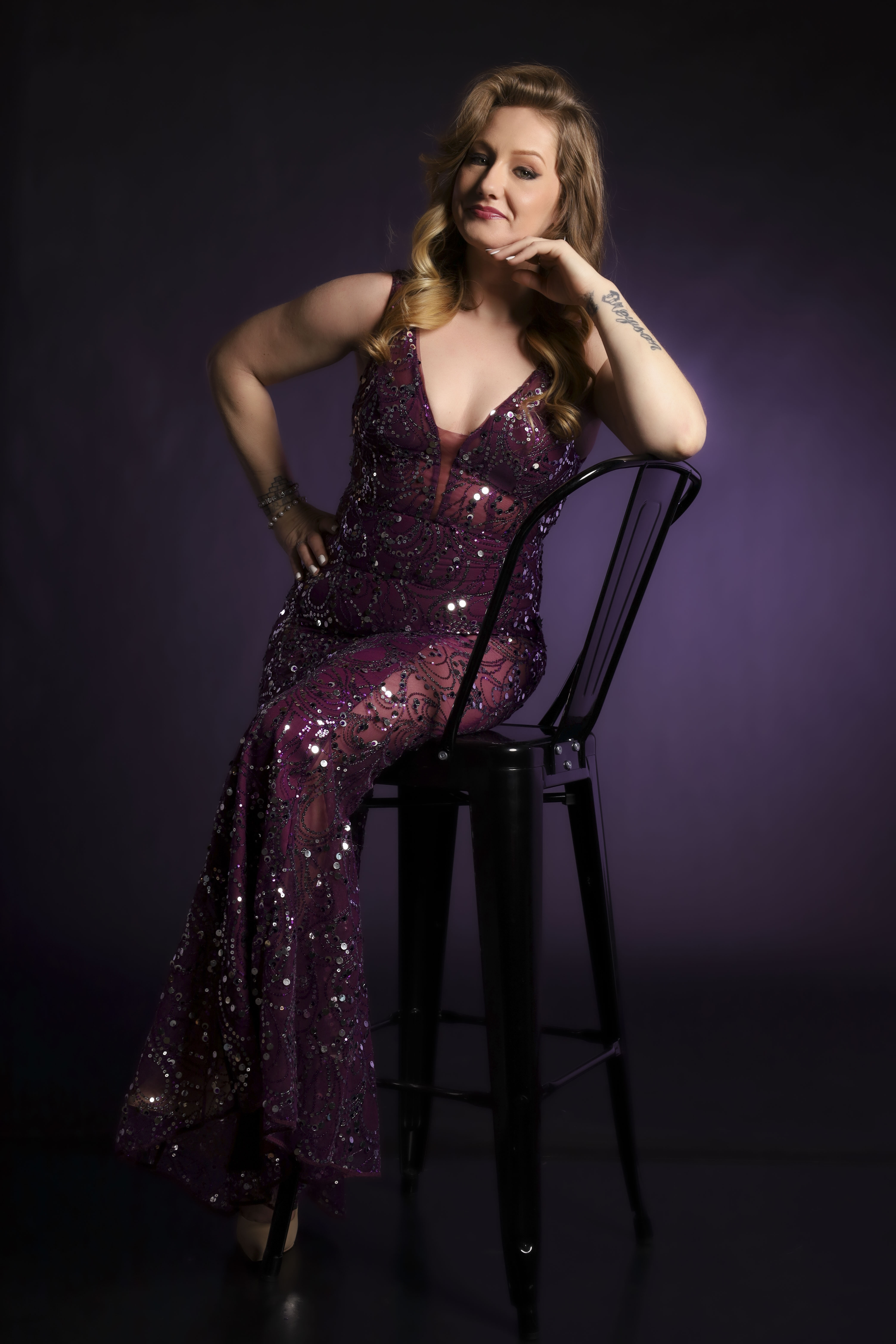 Brittany Harris in purple sequin gown