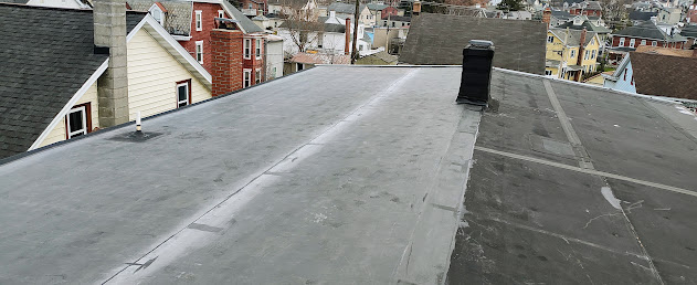 Completed EPDM flat rubber membrane roof in Ephrata PA — clean seams and flashed roof penetrations