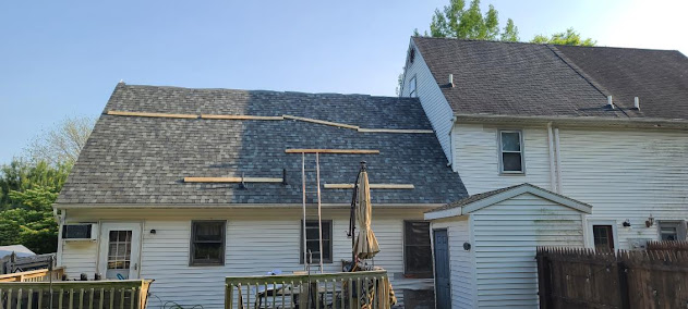 New shingles going on back view Cape Cod — partial architectural shingle install in progress