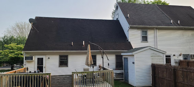 Old worn shingles on Cape Cod home back view — weathered curling shingles showing years of Central PA weather exposure