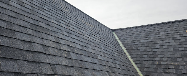 New architectural shingles on downtown Victorian — clean lines on completed main roof Lebanon PA