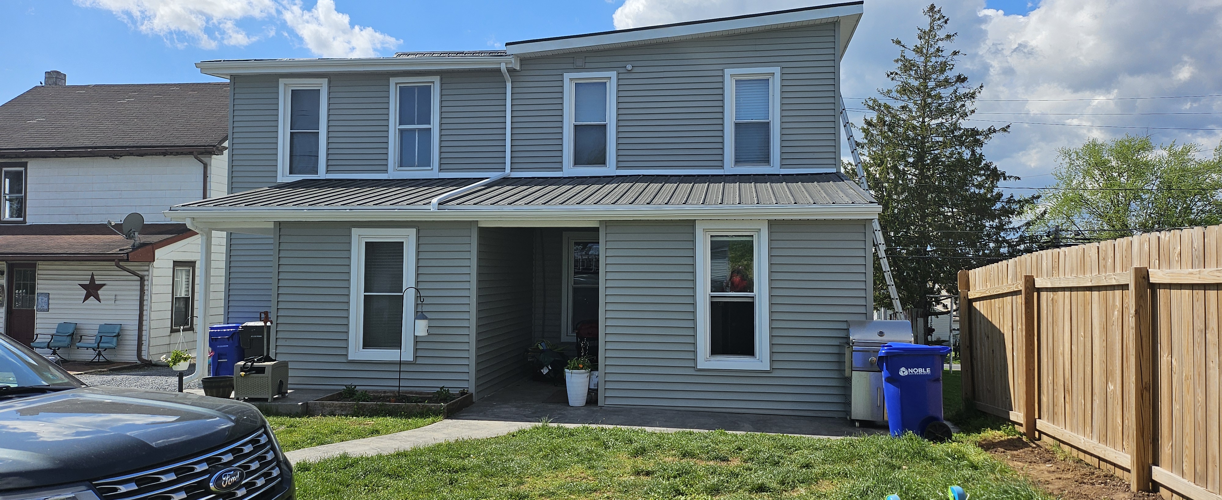 Siding after — new siding installation complete