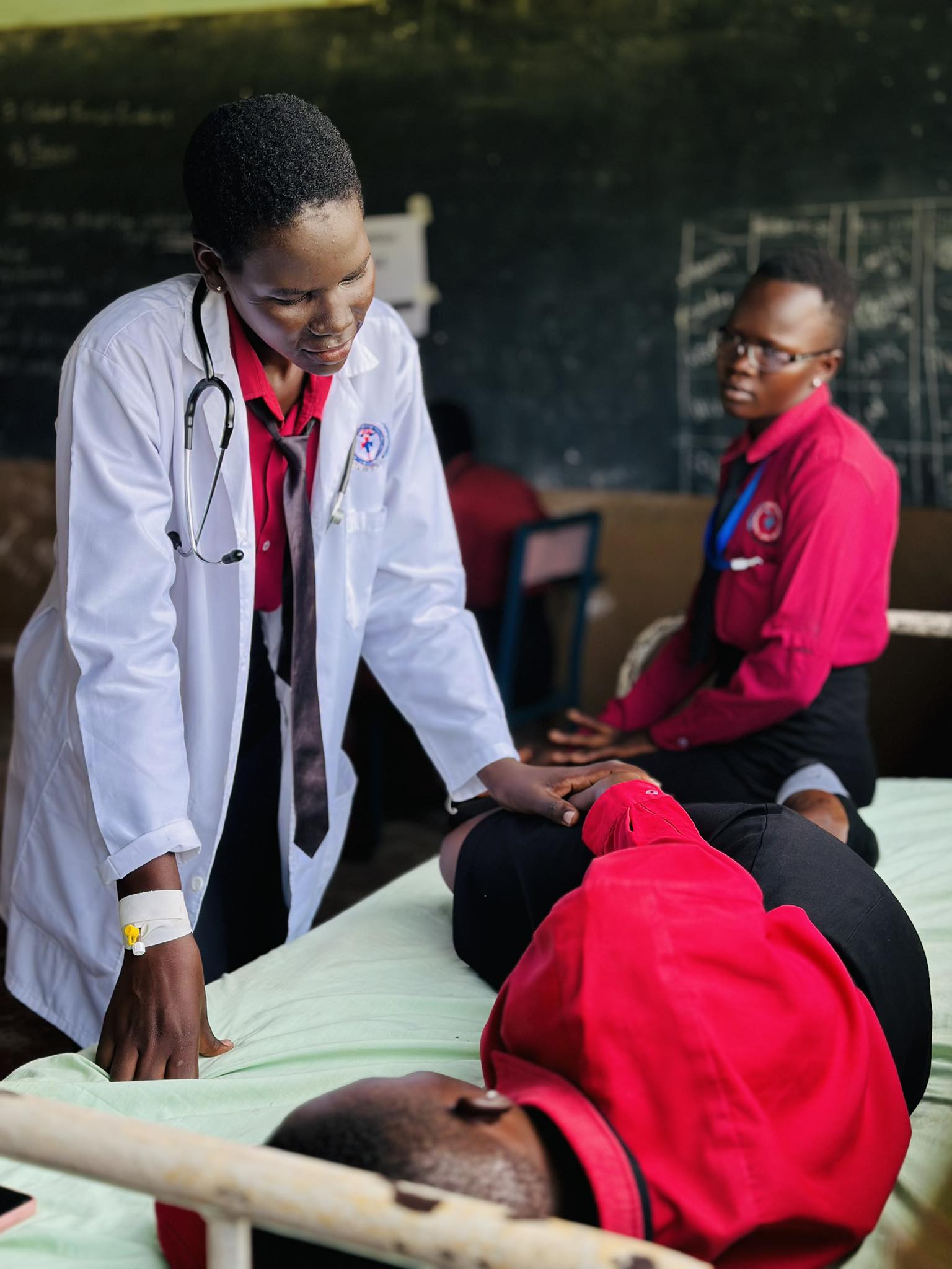 DCM/PH student studying under tent