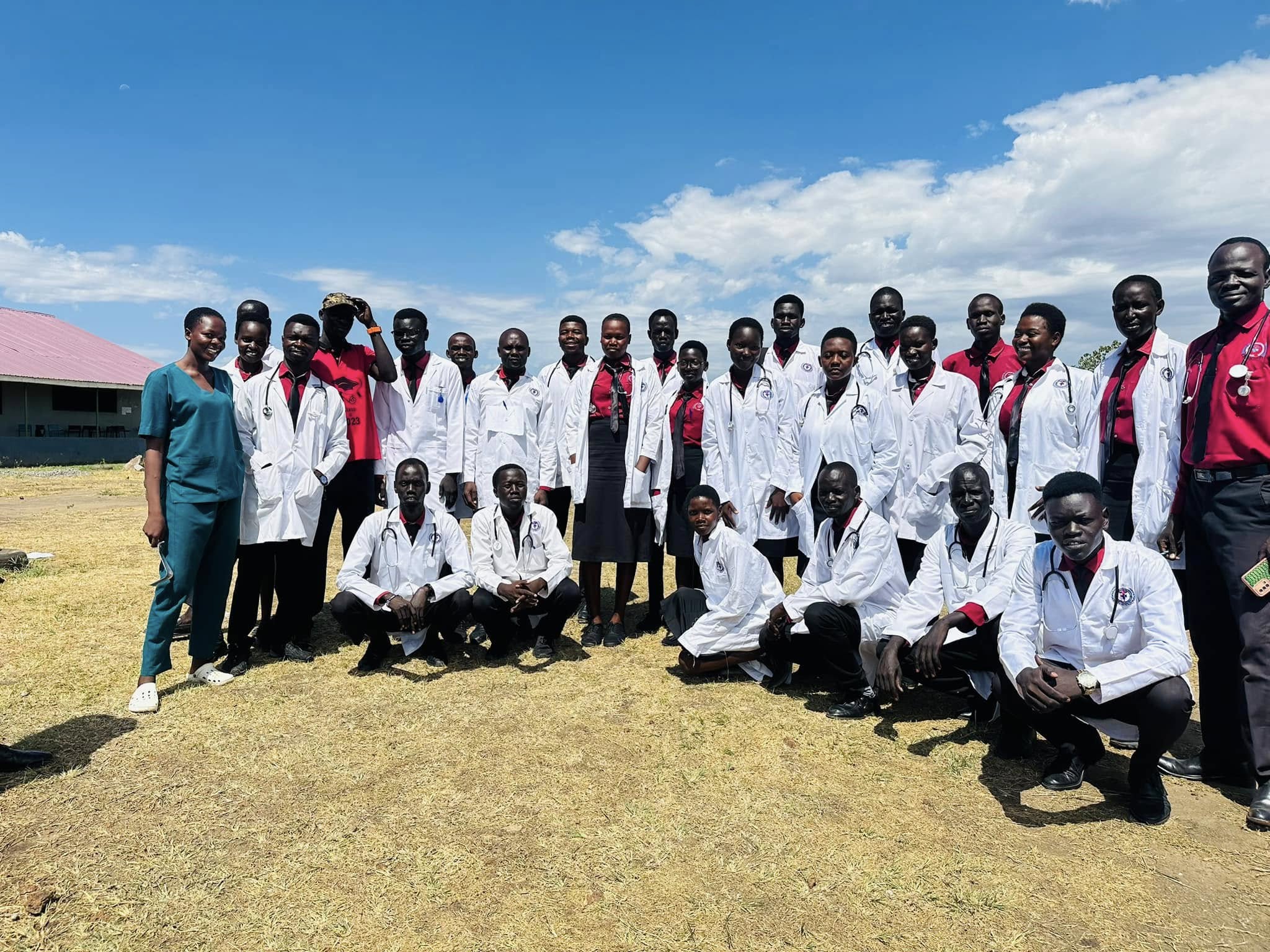 Graduation ceremony — proud graduates with diplomas