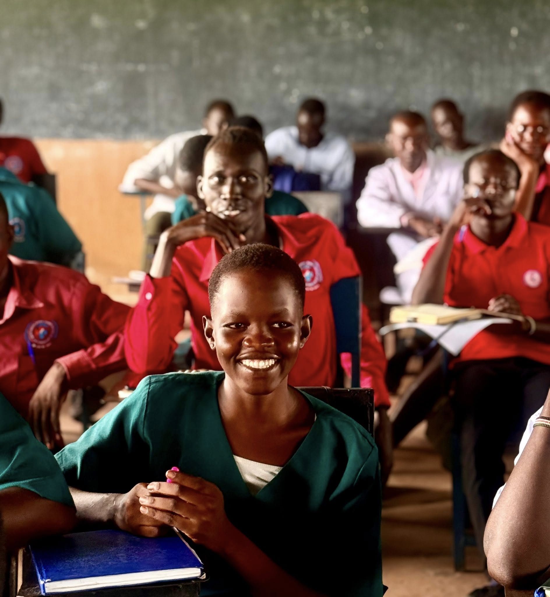 Student smiling in lecture hall