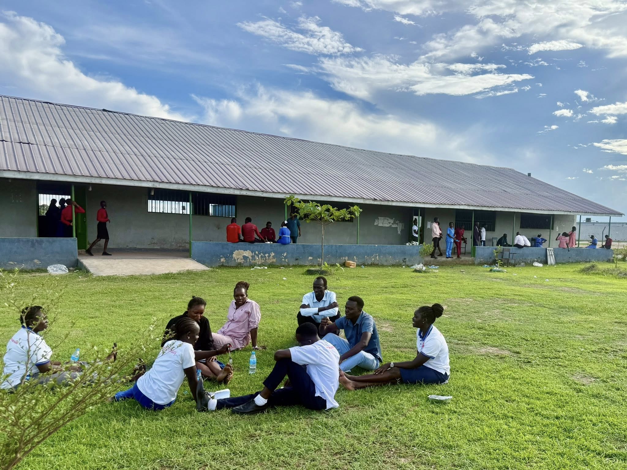 Students relaxing on campus grounds