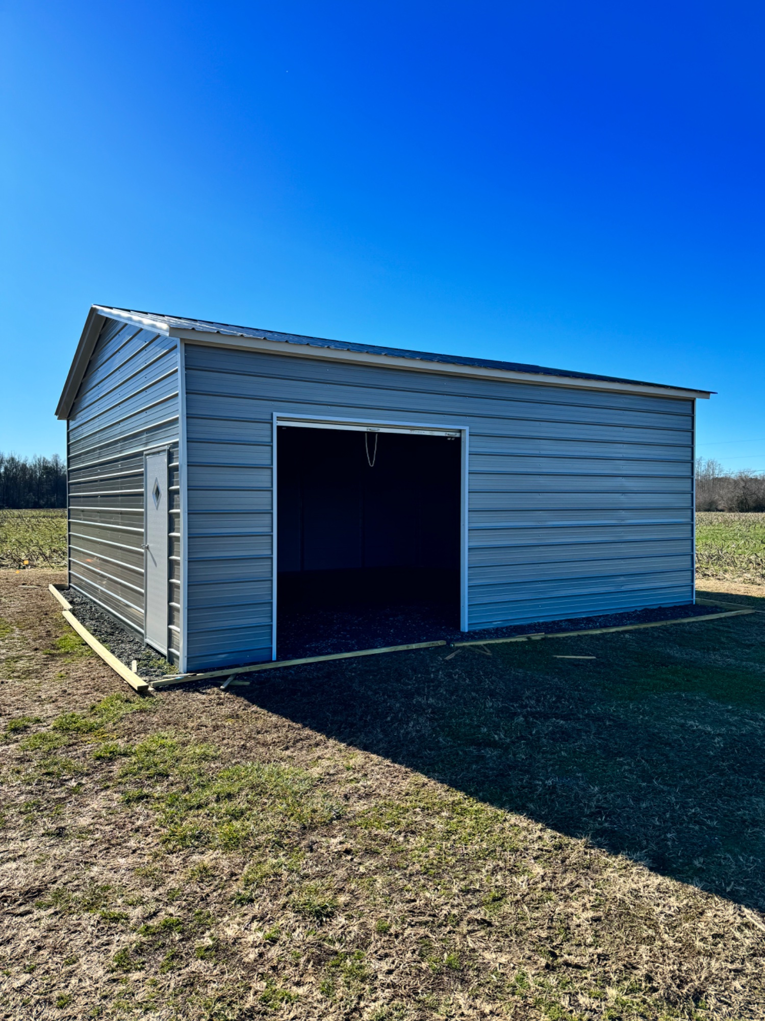 SwingDen building exterior — metal building with roll-up door in Warsaw, Virginia