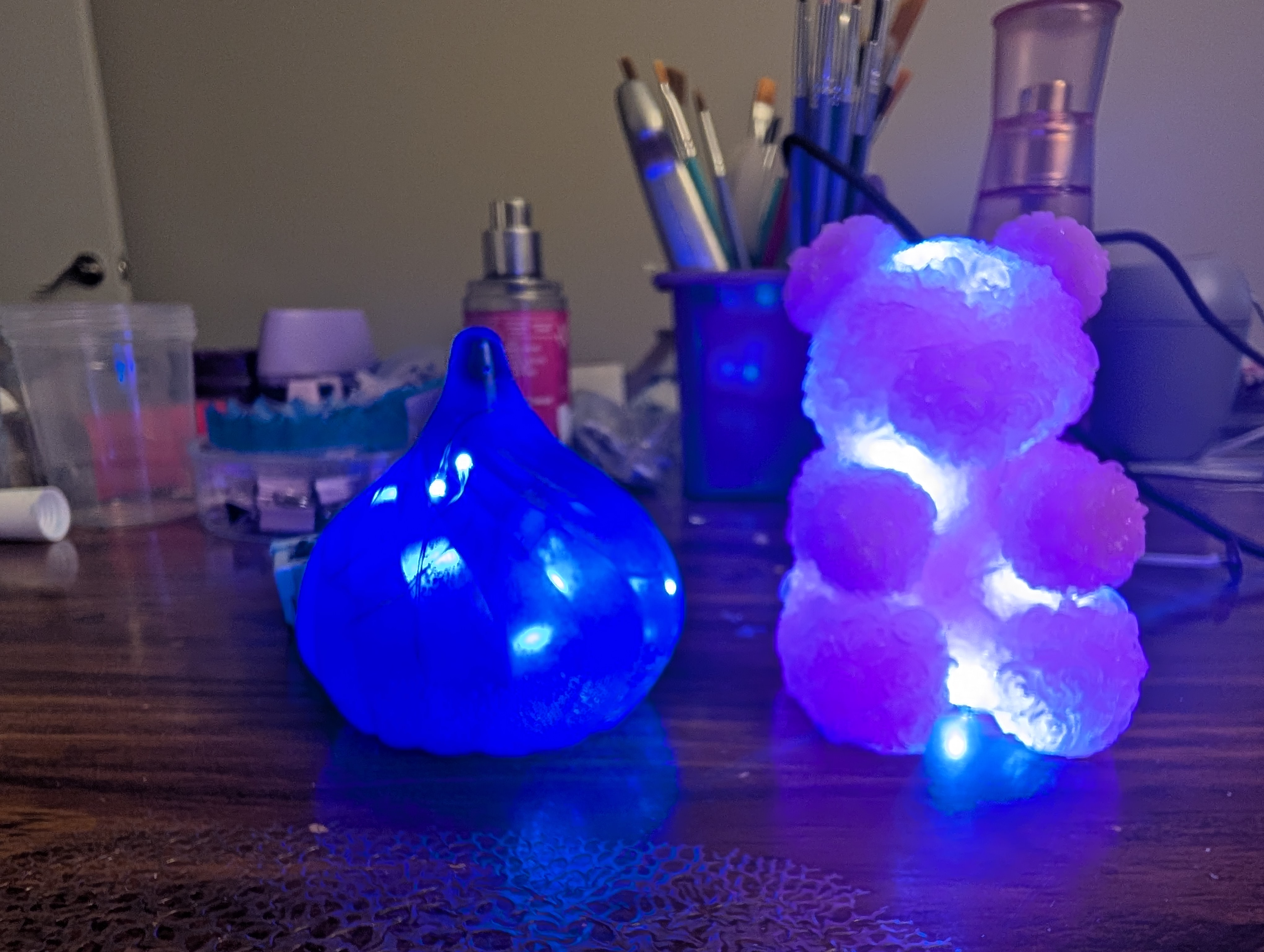 Handmade blue resin teardrop and pink rose bear glowing with LED lights