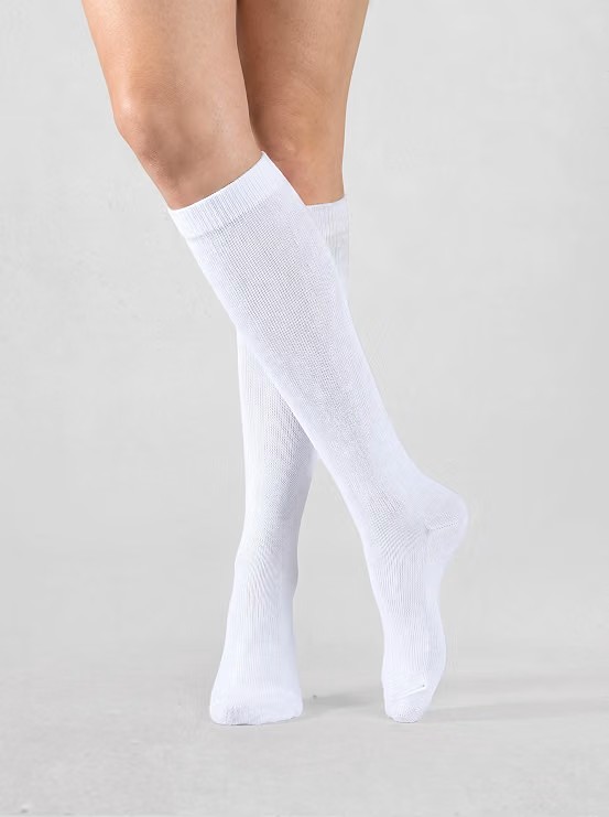 Cotton Knee High Socks (White) — The detail that pulls the whole silhouette together — without them, the skirt-and-loafer combo loses its collegiate edge. White keeps it crisp against the wine and plaid rather than competing with either color.