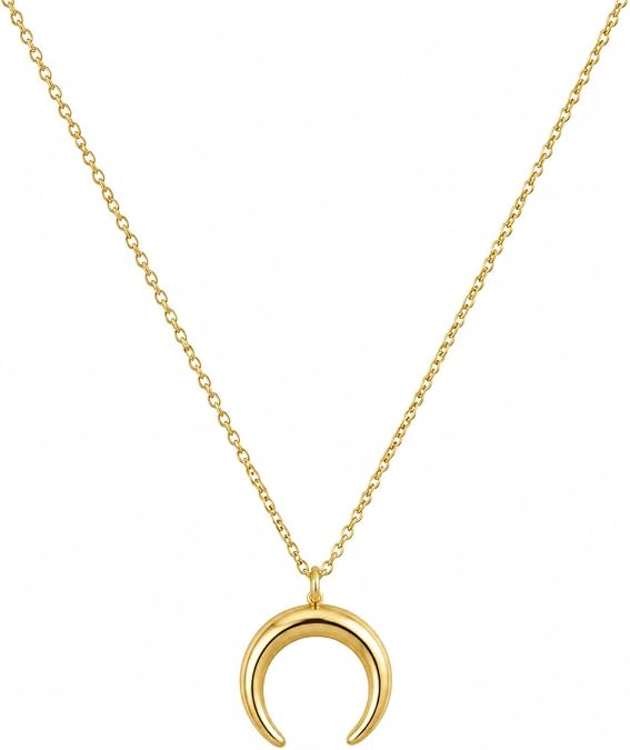 Crescent Moon Pendant — Delicate gold layering pieces soften the edges.