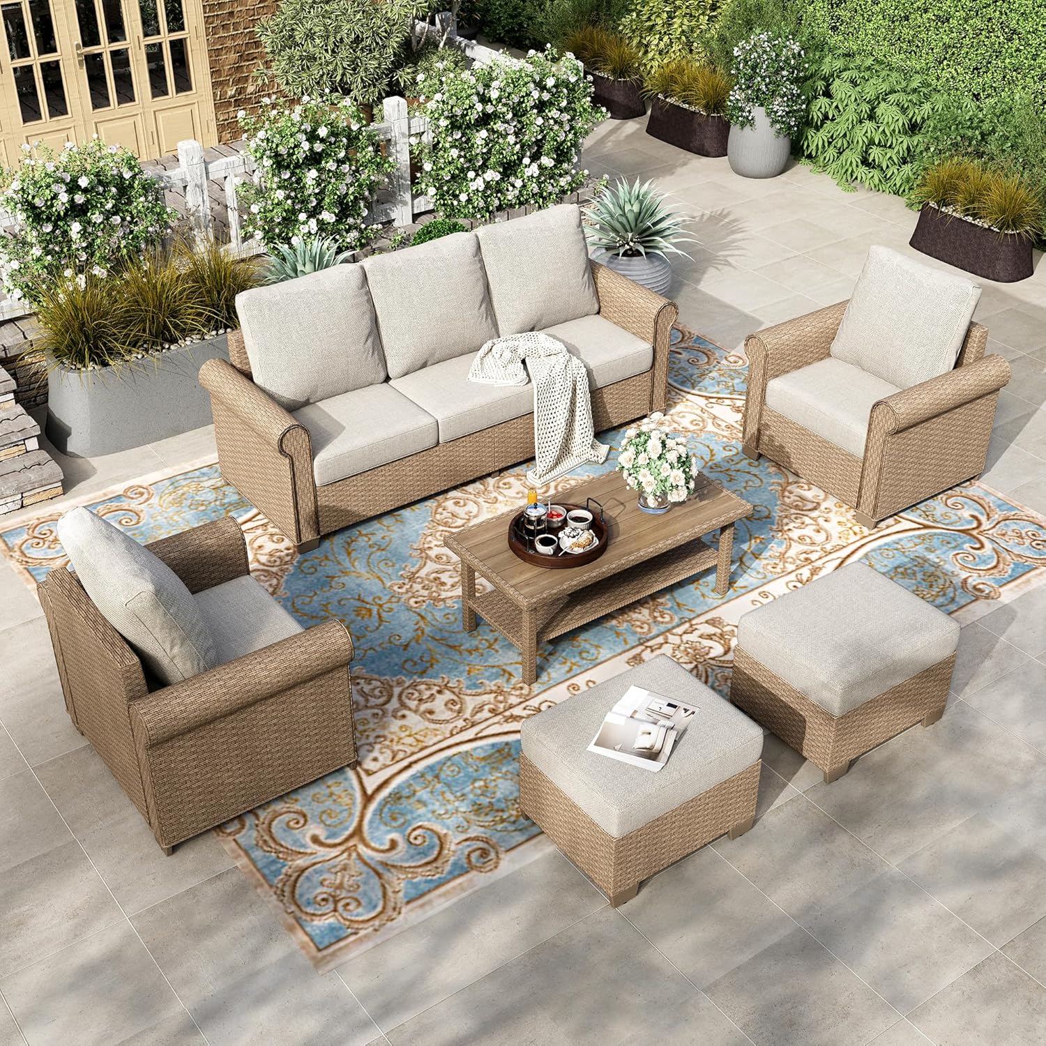 HERAS HOUSE 6-Piece Wicker Rattan Patio Set — Six-piece wicker rattan patio set with ottomans. Weather-resistant and ridiculously comfortable. This is what we actually sit on every evening.