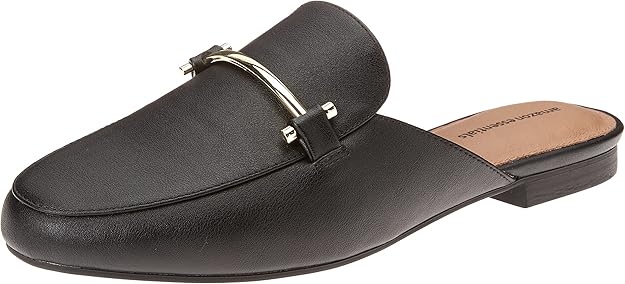 Black Buckle Mules — Flat black buckle slide mules for comfortable travel.