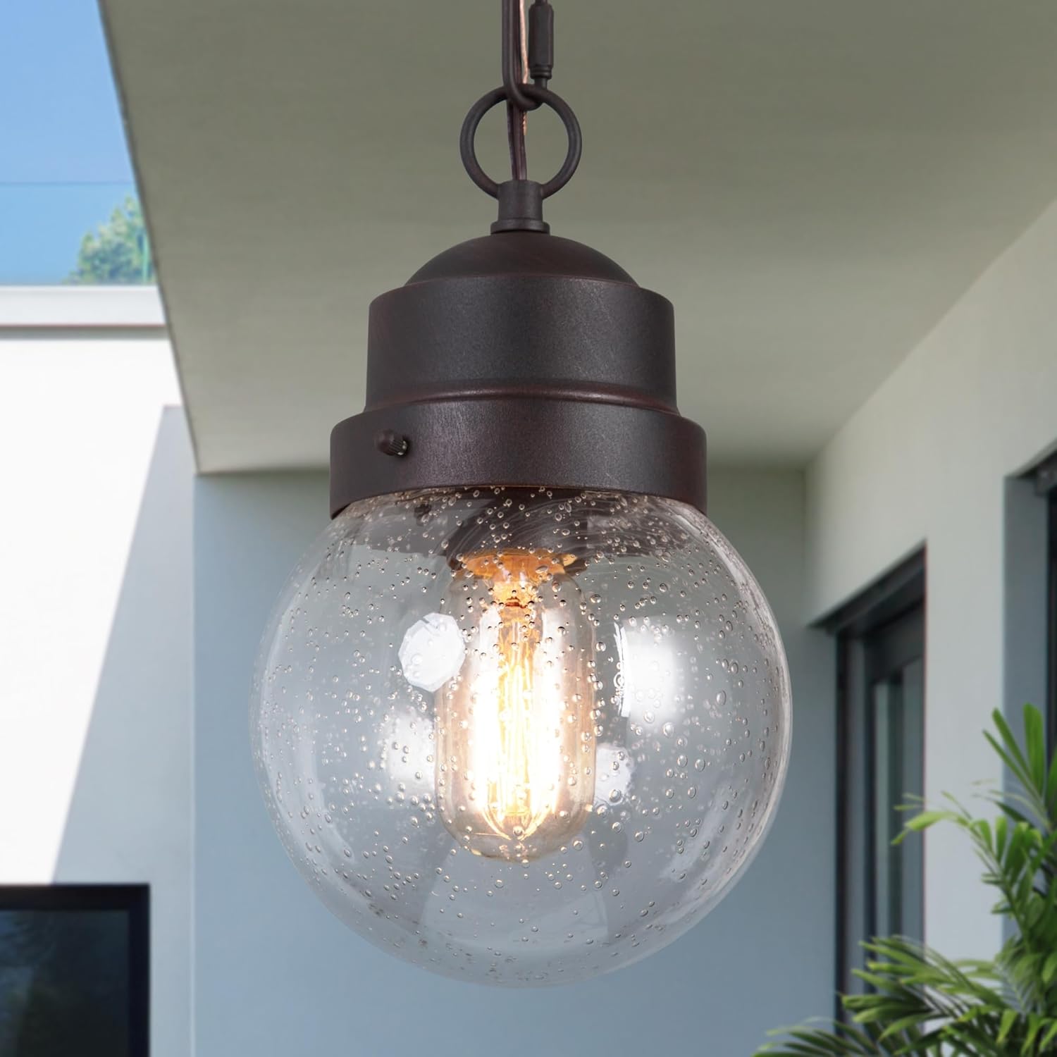 Bronze Outdoor Globe Pendant Light — Industrial bronze pendant with seeded glass. Hardwire installation but absolutely worth it for the elevated outdoor room vibe.