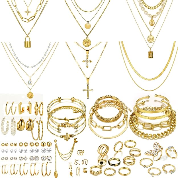 Gold Layered Jewelry Stack — Layered gold necklaces and earrings set.