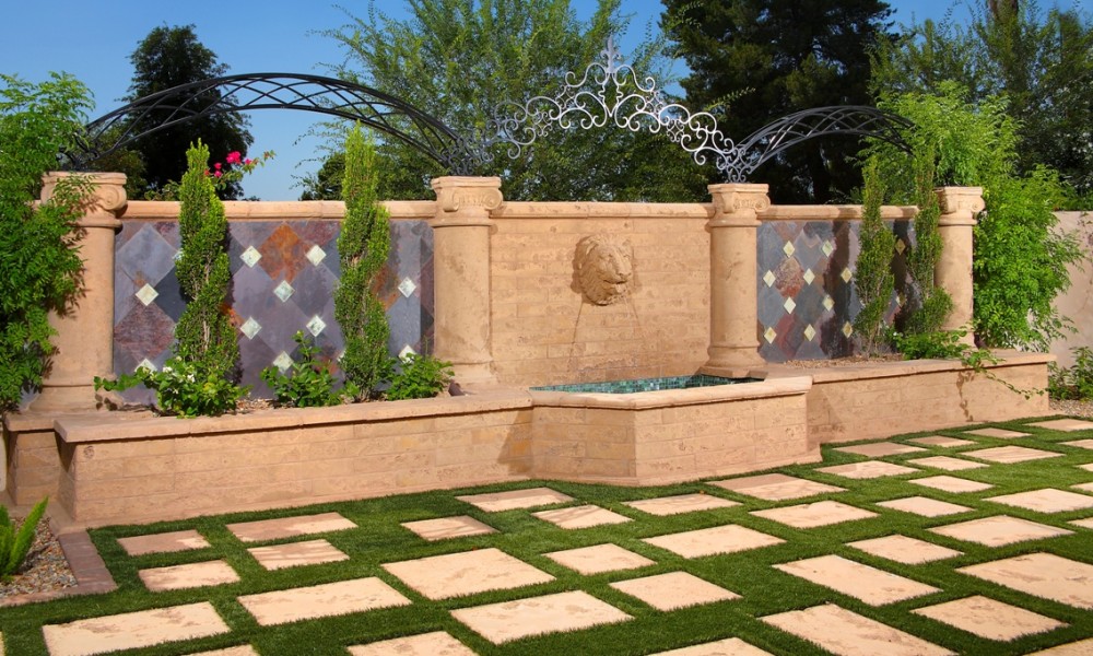 Lion head fountain detail with precast concrete pavers &mdash; Mesa Precast custom GFRC and precast landscape elements for luxury outdoor living