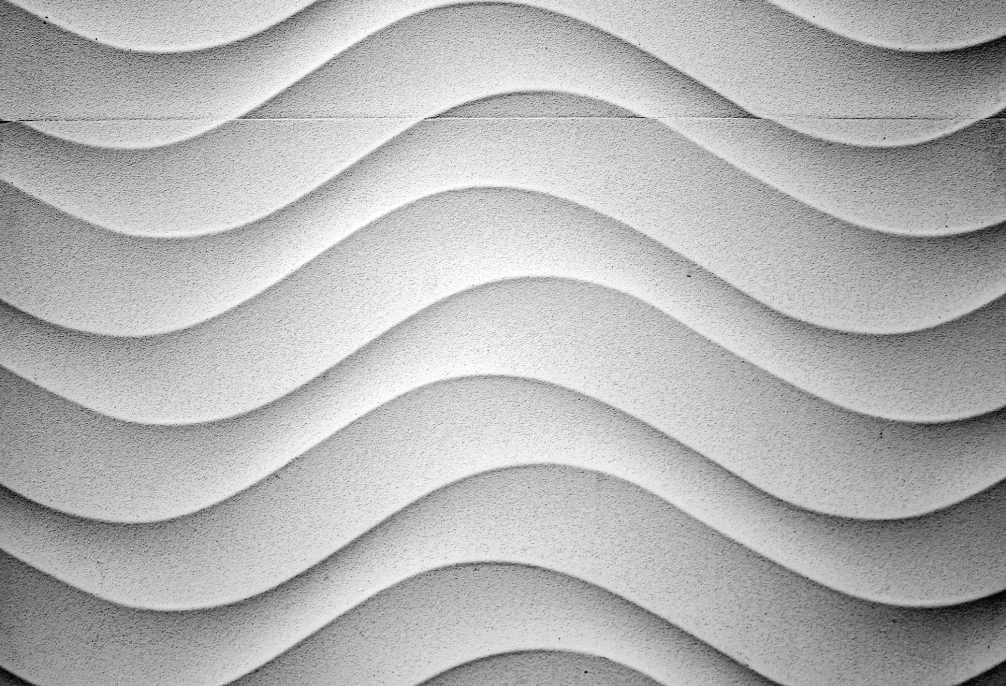 Architectural cast stone wall panels with precision geometric texture — Mesa Precast cast stone cladding for commercial and residential projects