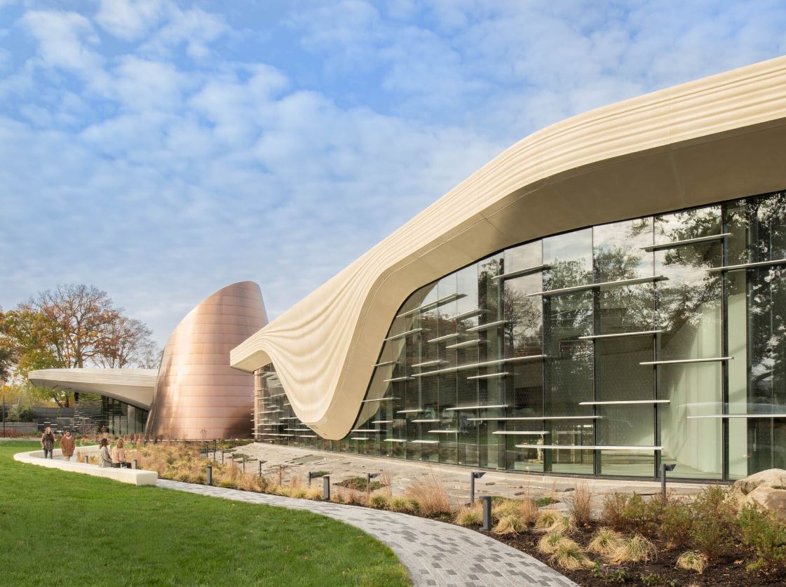 Cleveland GFRC building — modern flowing/undulating GFRC cladding panels on a museum/cultural building with glass curtain wall