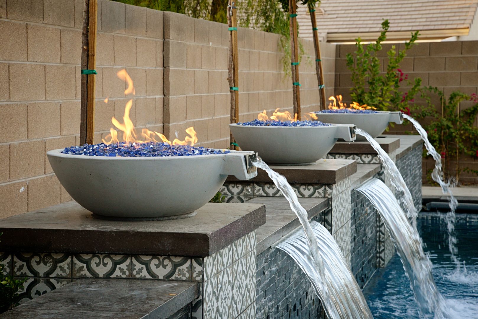 Cast stone fire and water bowls poolside