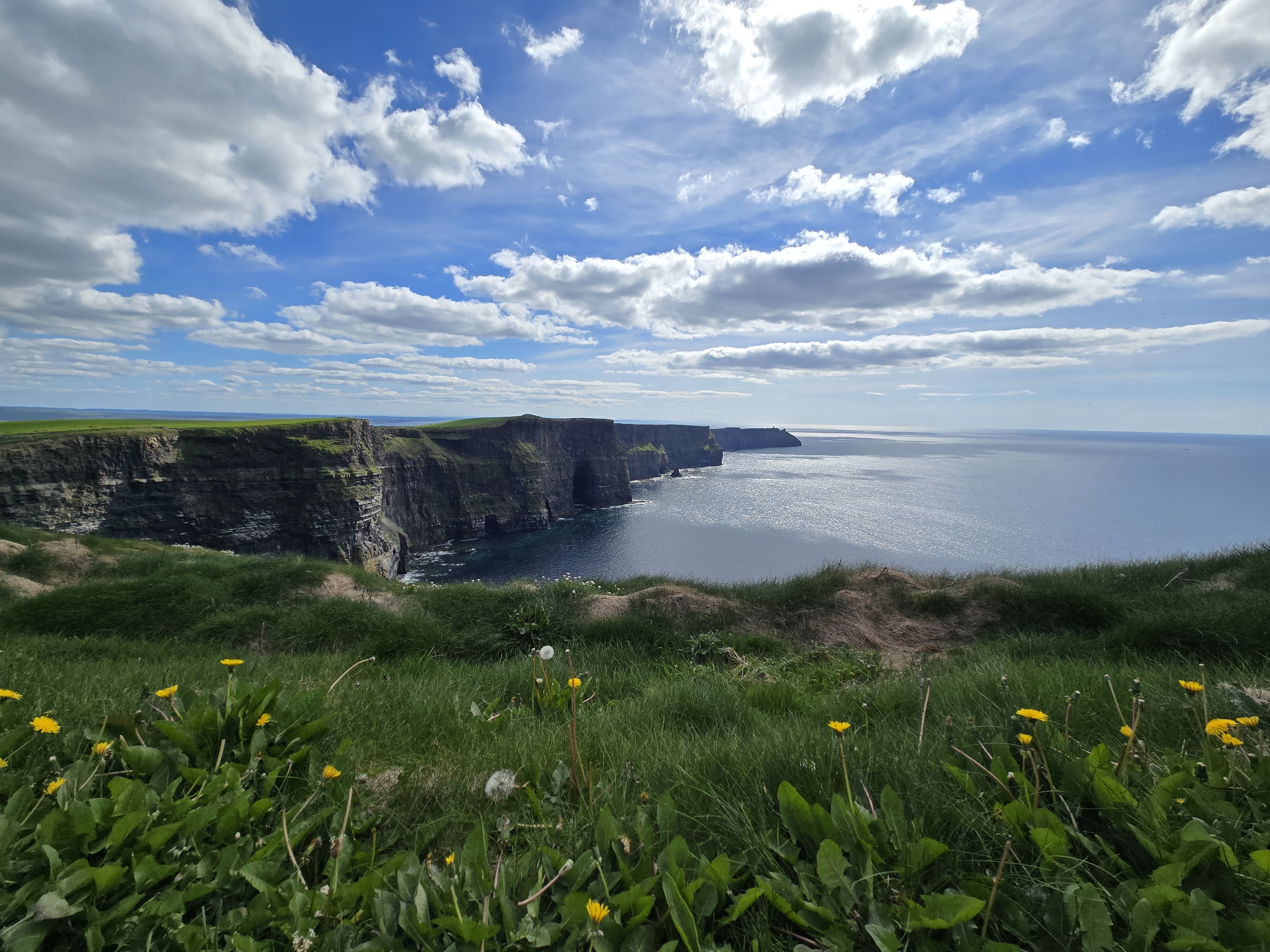 Atlantic cliffs and sea beneath a bright sky