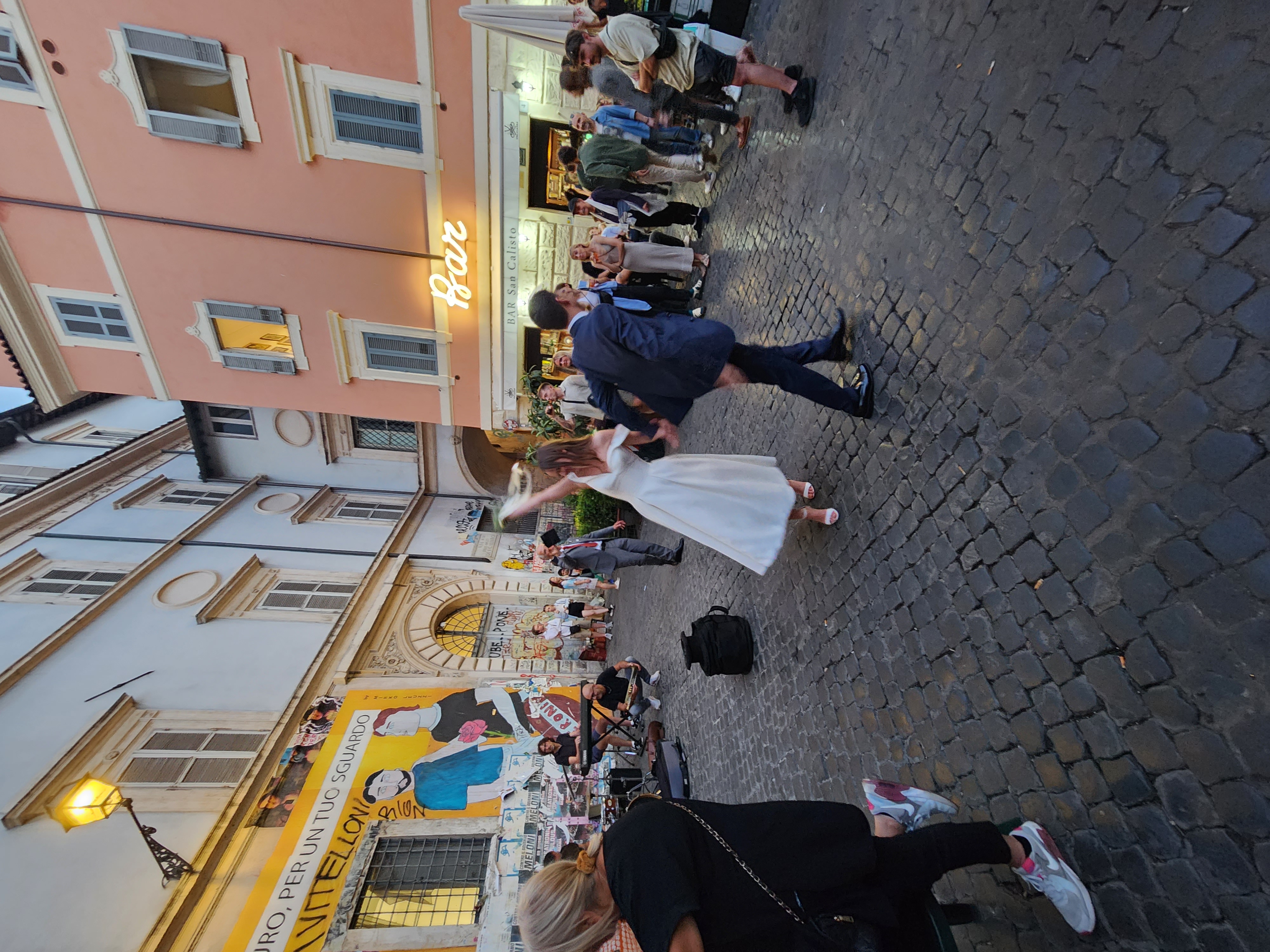 Lively Rome street life and a moment of celebration.
