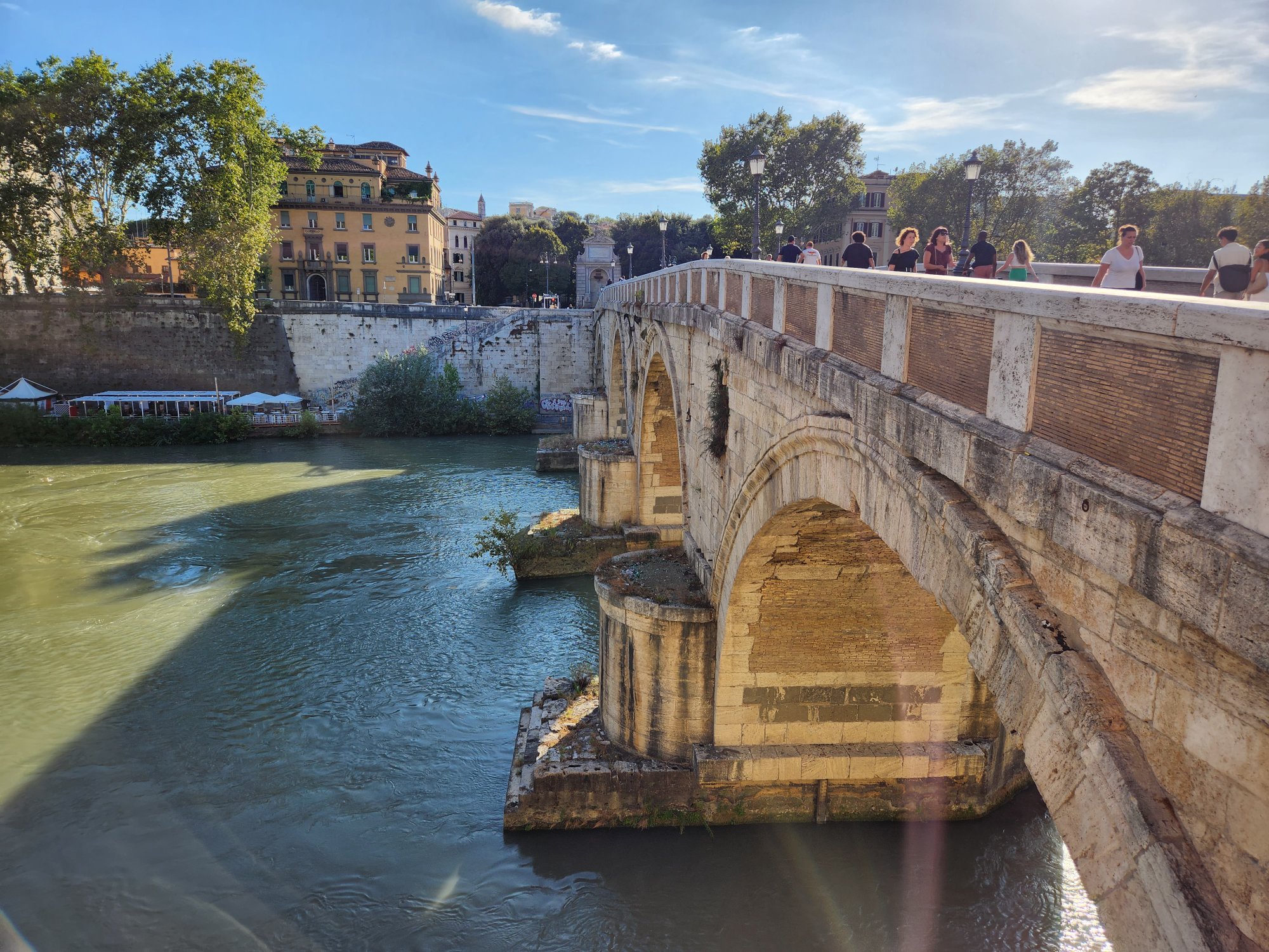 A Rome river and bridge view for an unhurried city wander.